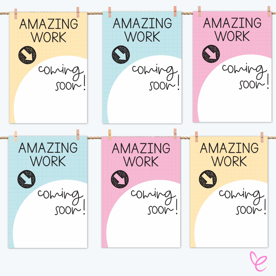 Six "Amazing Work Coming Soon" posters in pastel blue, yellow, and pink, clipped to a rope. Each poster features a large blank circular space for showcasing student work.