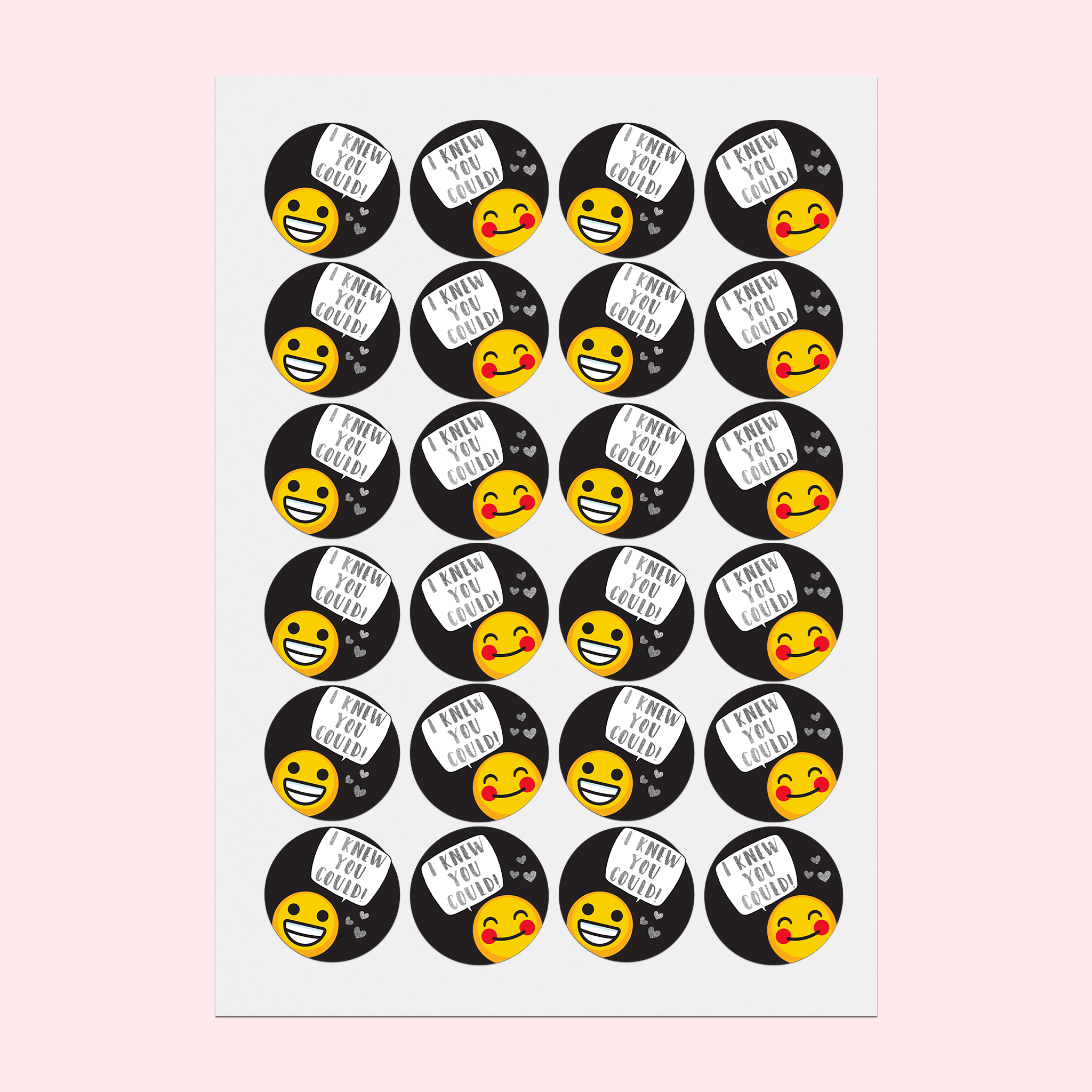 A5 sticker sheet on a desk featuring happy emojis on a black background, with silver foiled hearts and speech bubbles saying 'I knew you could!'