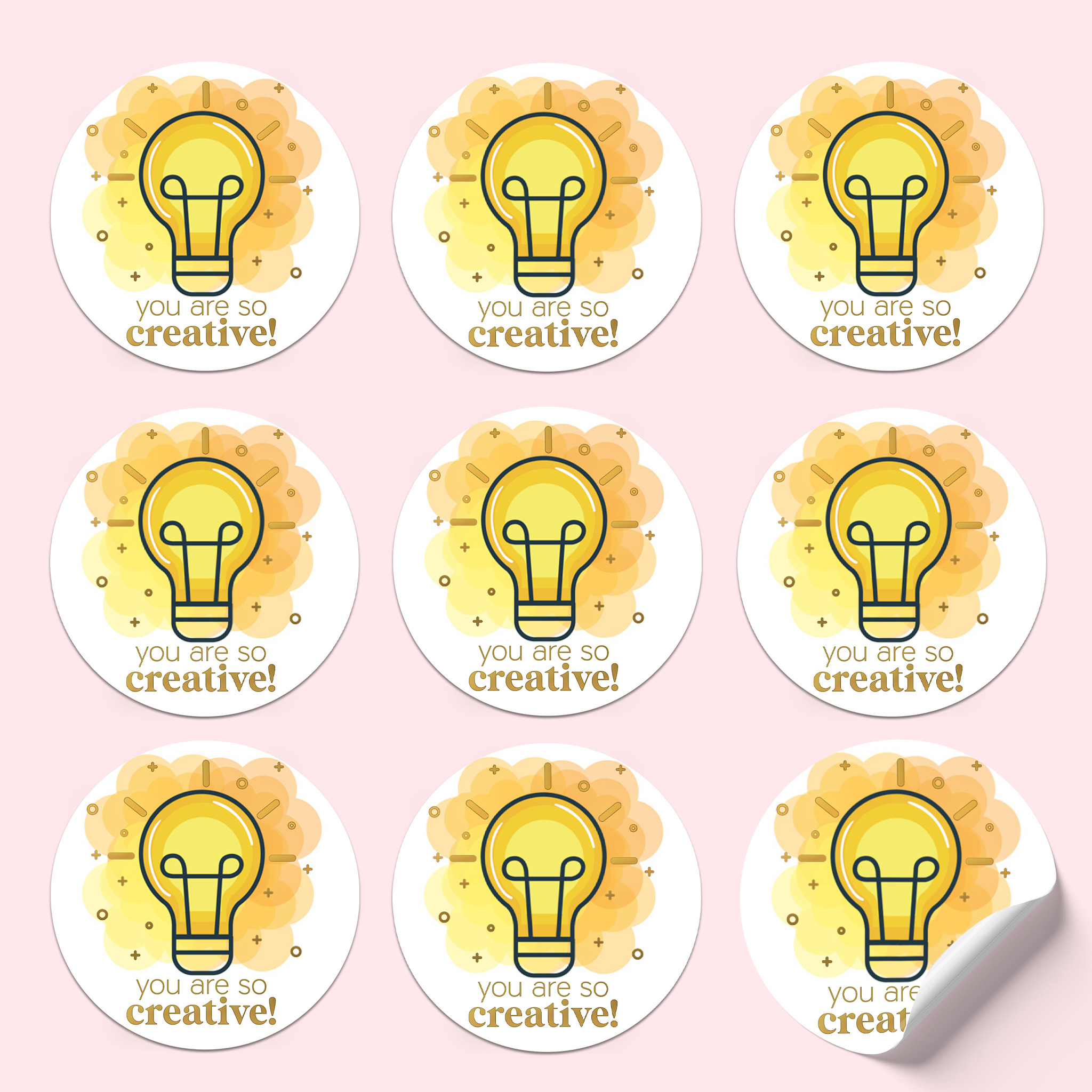 Sticker sheet with yellow lightbulbs and orange clouds on a white background, featuring gold foiled text saying 'You are so creative!'