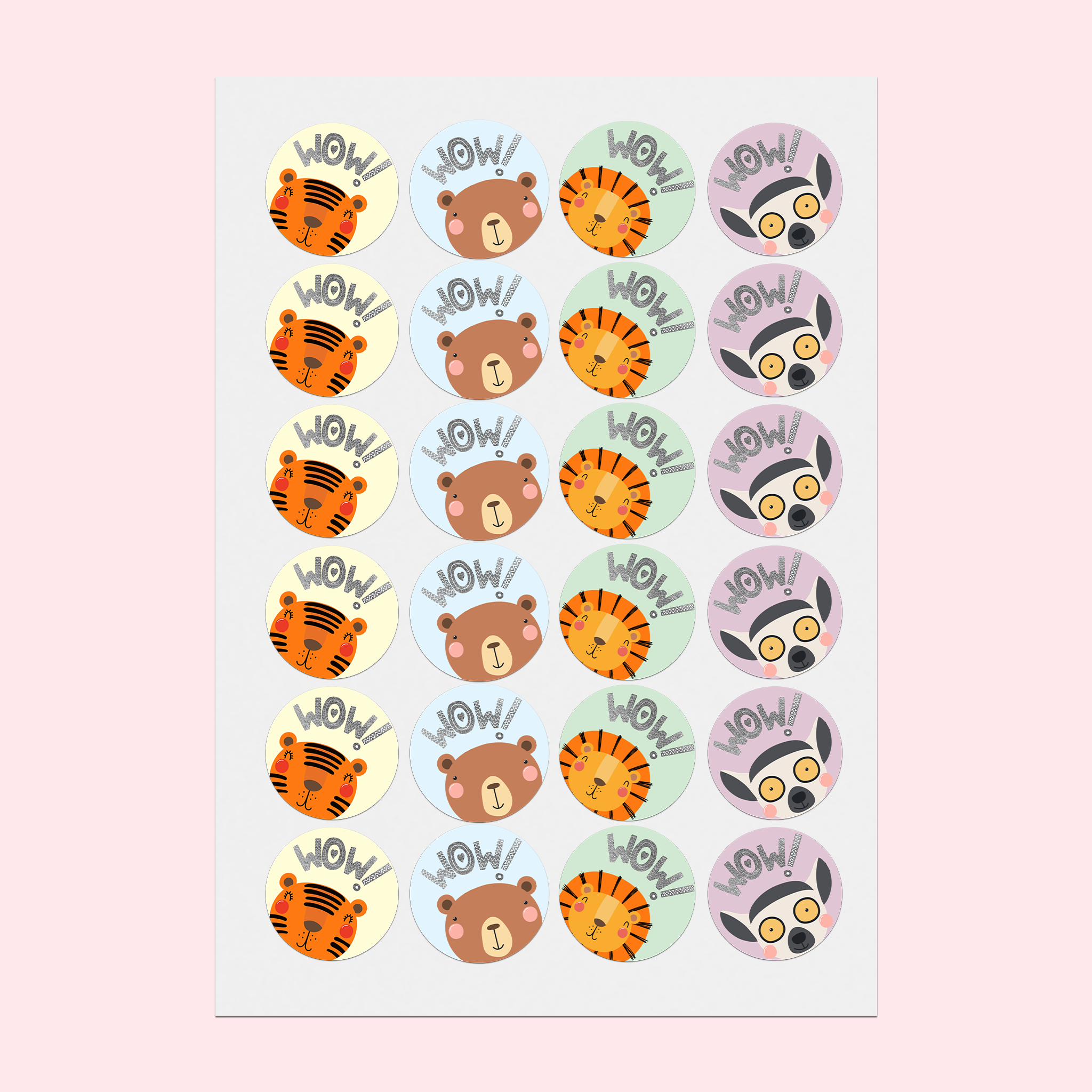 A5 sticker sheet flat on a desk, featuring cute happy animals on pastel backgrounds with silver foiled text that reads 'Wow!'