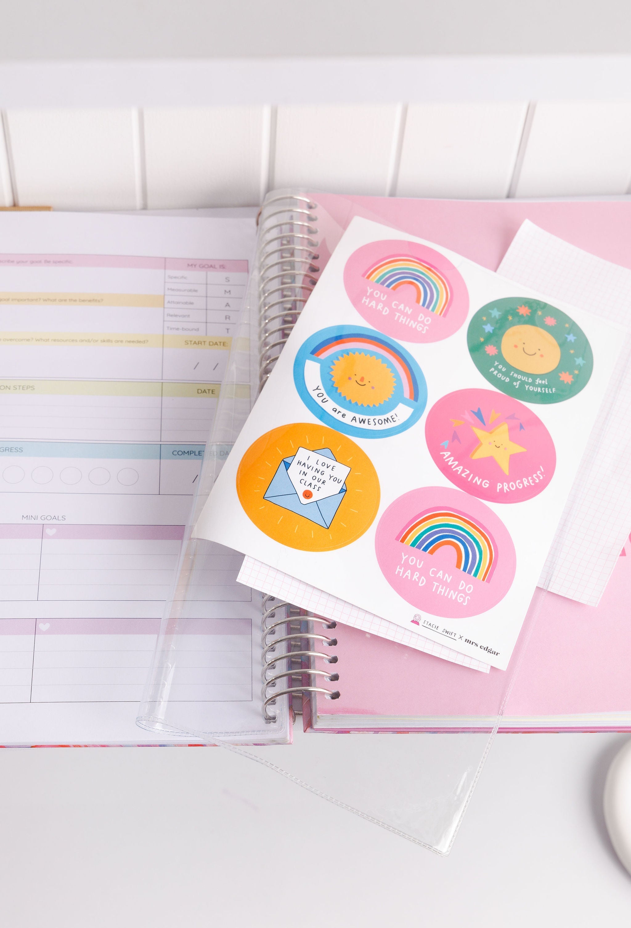 Styled image of the clear sleeve inside the teacher planner holding Stacey Swift stickers, showcasing organised storage and vibrant sticker designs.
