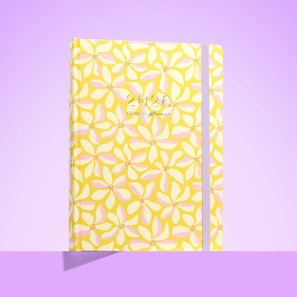 2026 teacher planner with pink cover, bold red cherries and hearts, gold year lettering, pink elastic strap, and ribbon markers.