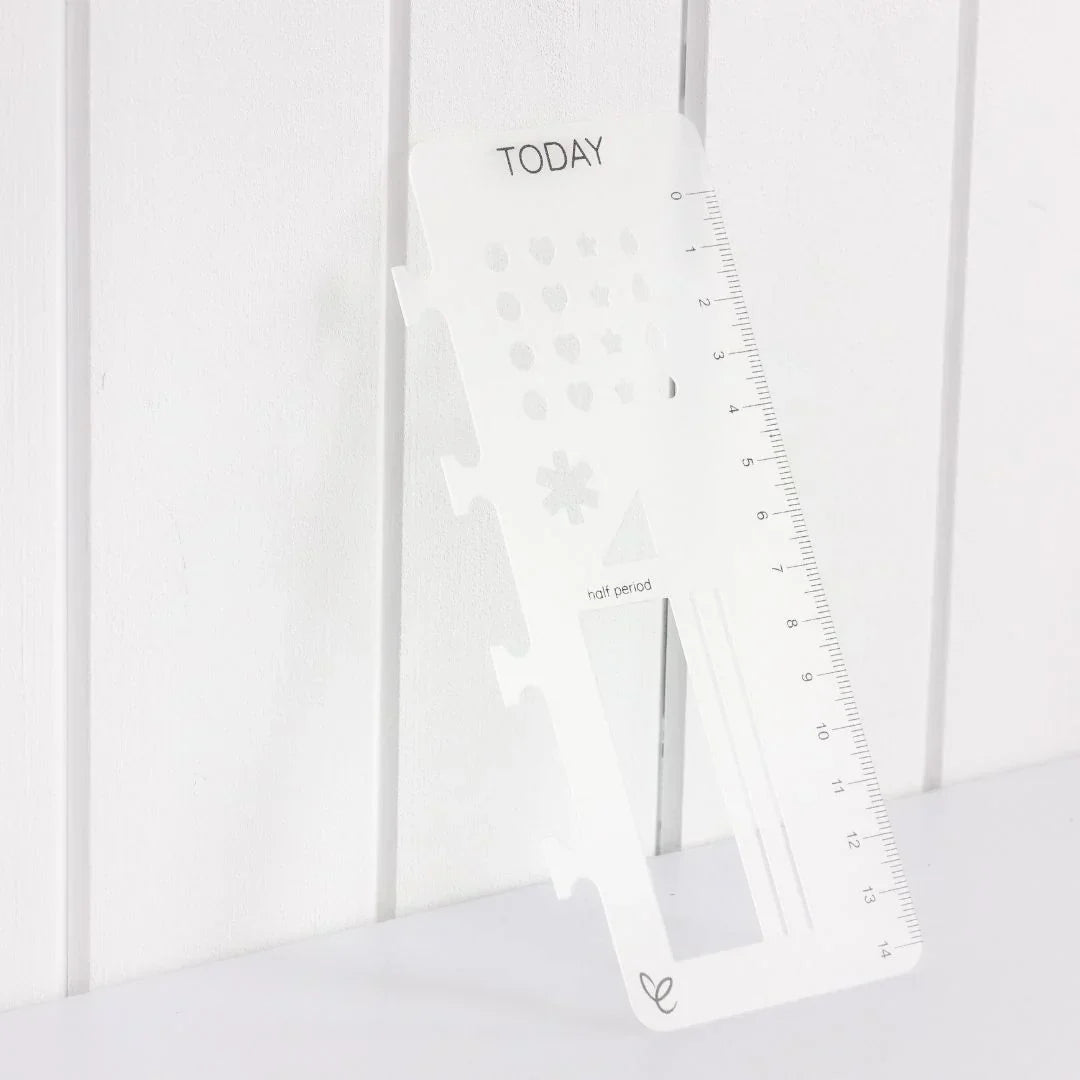  Clip-in stencil ruler labelled "Today," designed for teacher planners, leaning against a white timber wall.