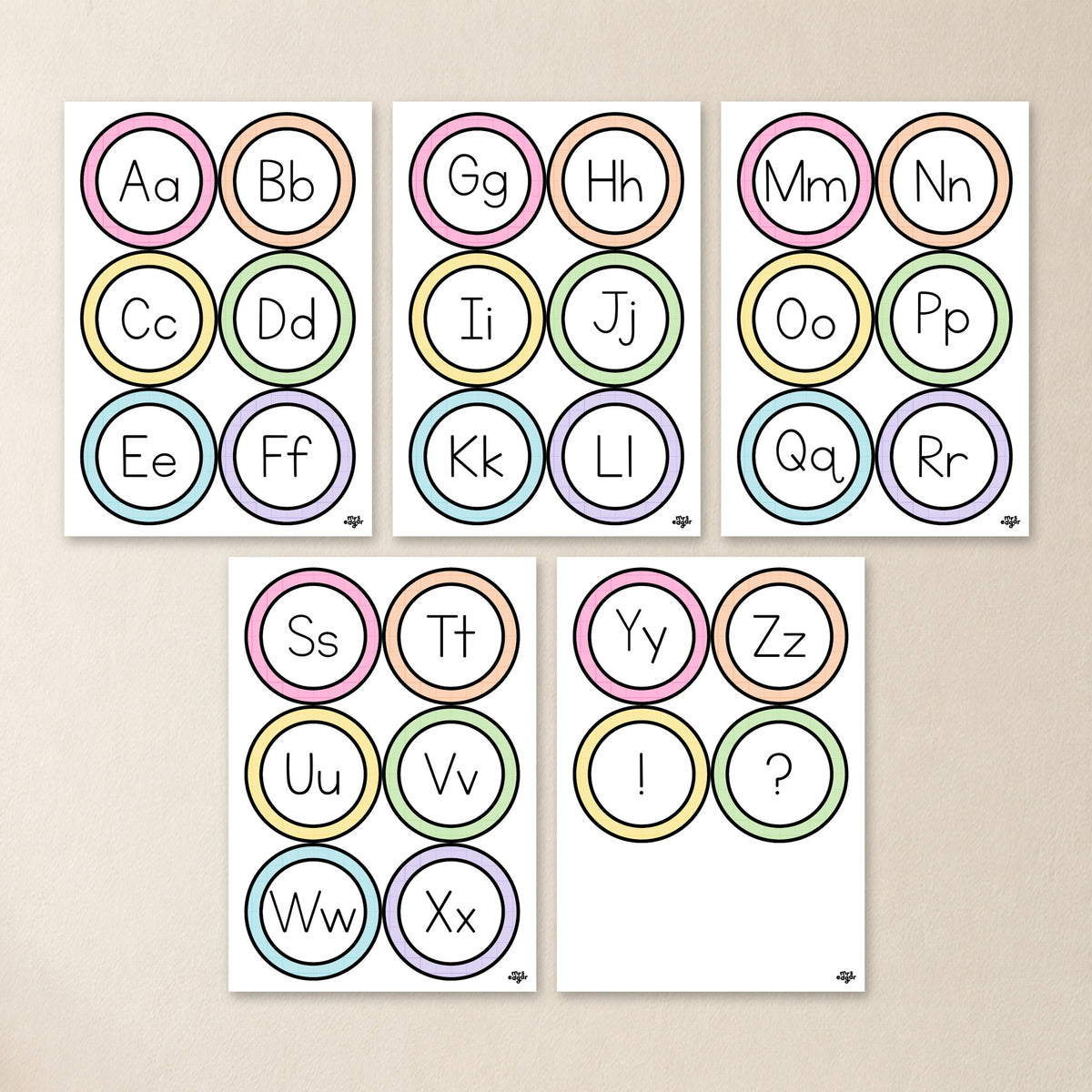 Printable alphabet circles tiled on A4 pages with cut dashes, in six Australian school fonts