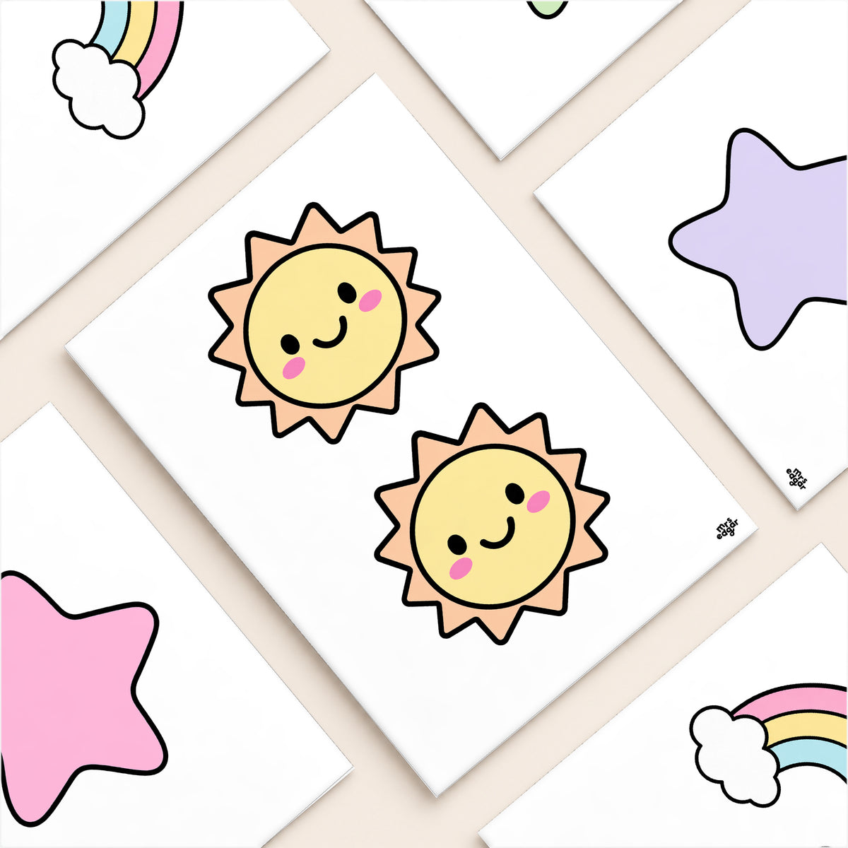 Flat lay of cut-out rainbow, star and sun garland pieces, soft Gentle colours