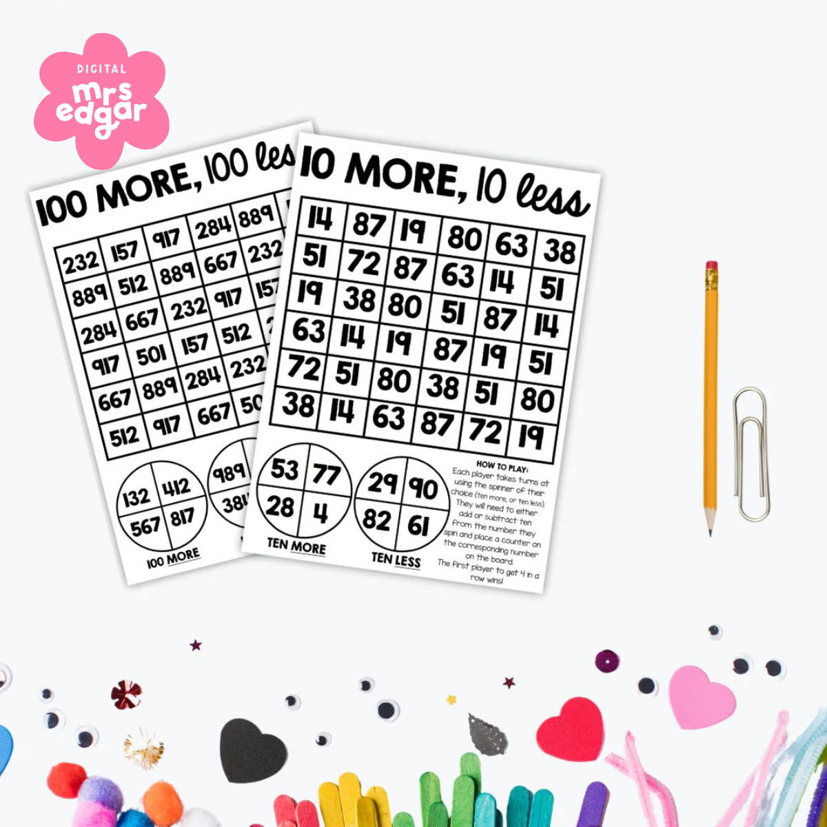 A photo of the Interactive 10 More and Less, 100 More and Less games for kids, featuring a white background displayed with over craft items.