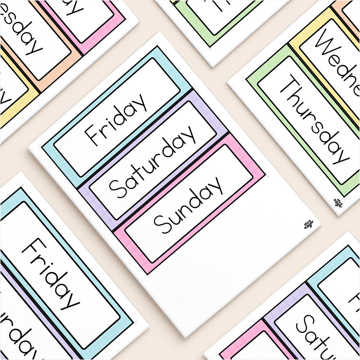 Flat lay of printed arch-topped days of the week cards in soft Gentle colours