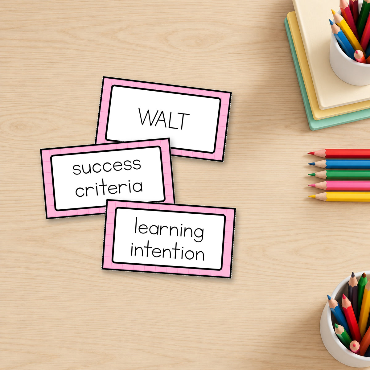 Three simple panel Learning Intention signs standing on a desk in soft Gentle colours