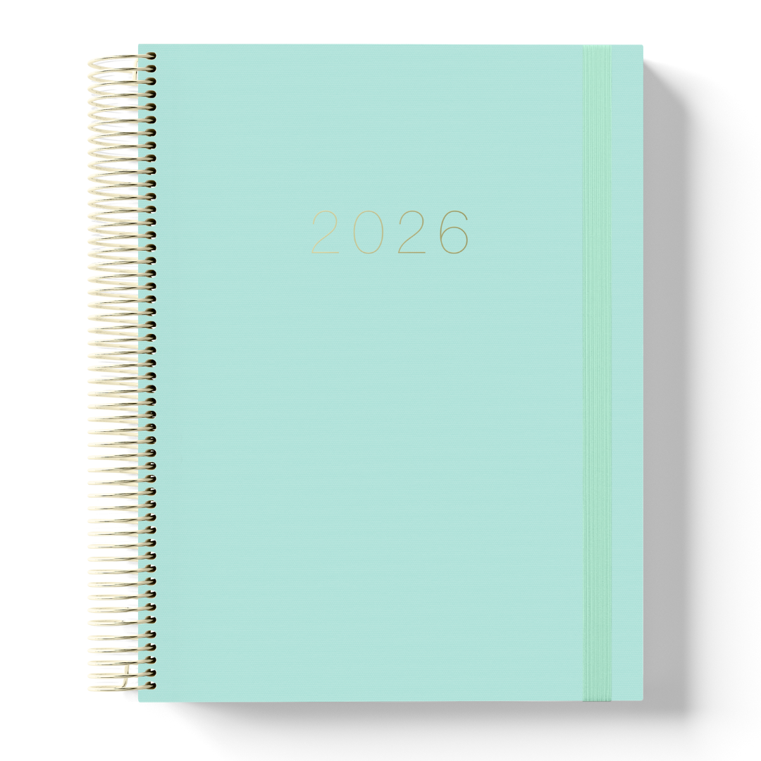 2026 teacher planner with a minimalist mint green cover, gold foil text, gold coil binding, and matching green elastic strap.