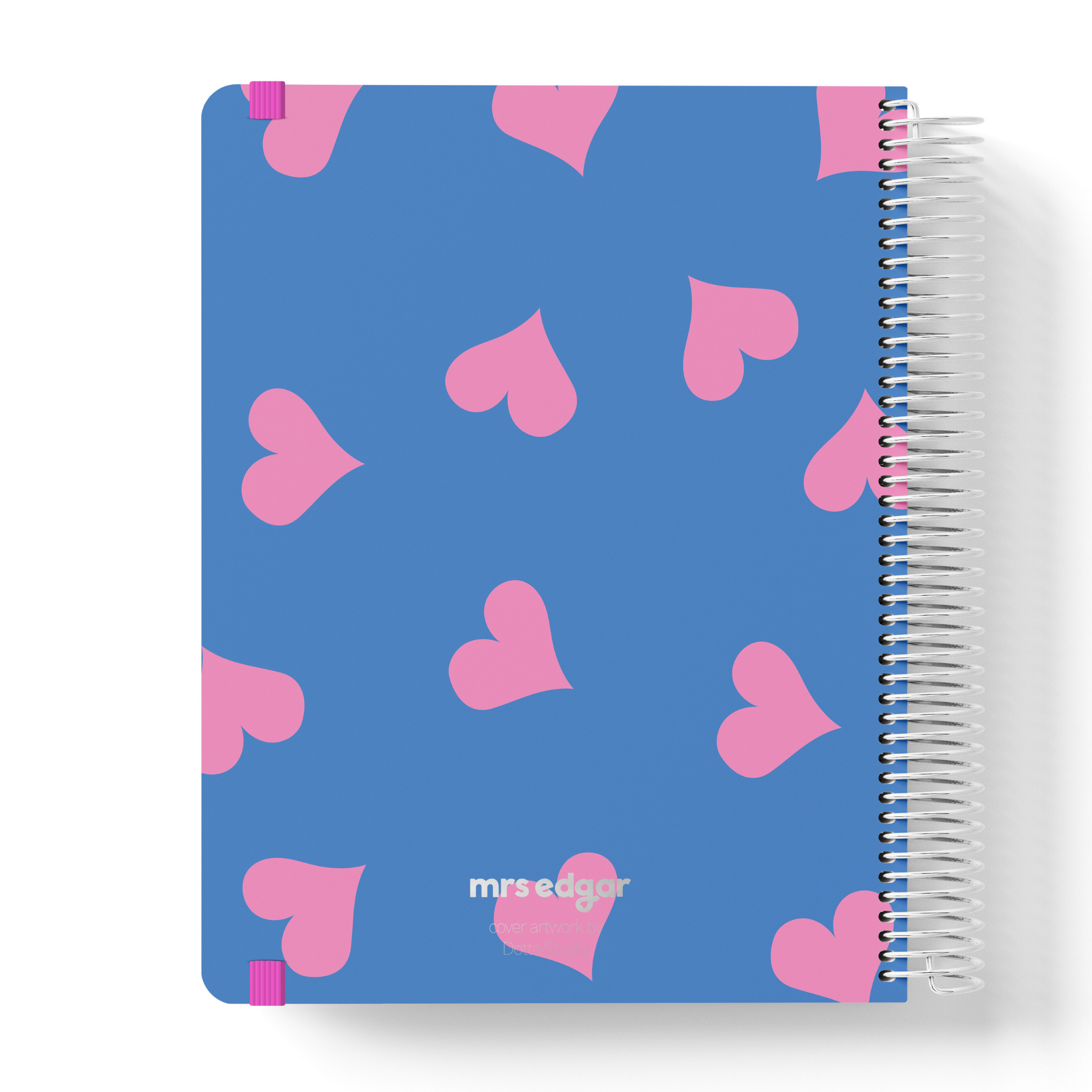 2026 teacher planner with a bold blue cover, scattered pink hearts, and silver coil binding