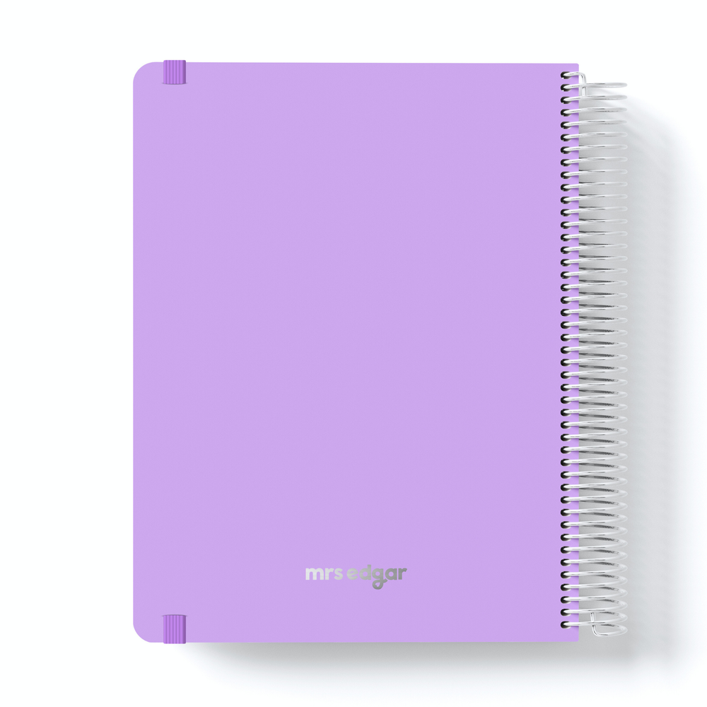 Lavender teacher planner with silver “mrs edgar” logo, spiral binding on the right and corner protectors.