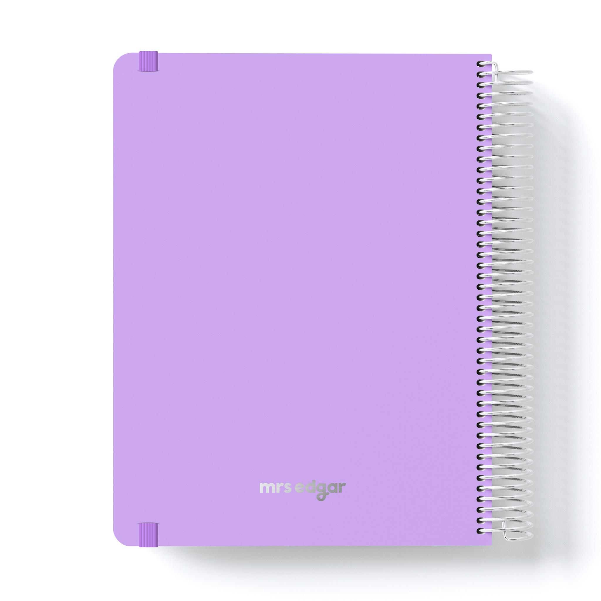 Lavender teacher planner with silver “mrs edgar” logo, spiral binding on the right and corner protectors.