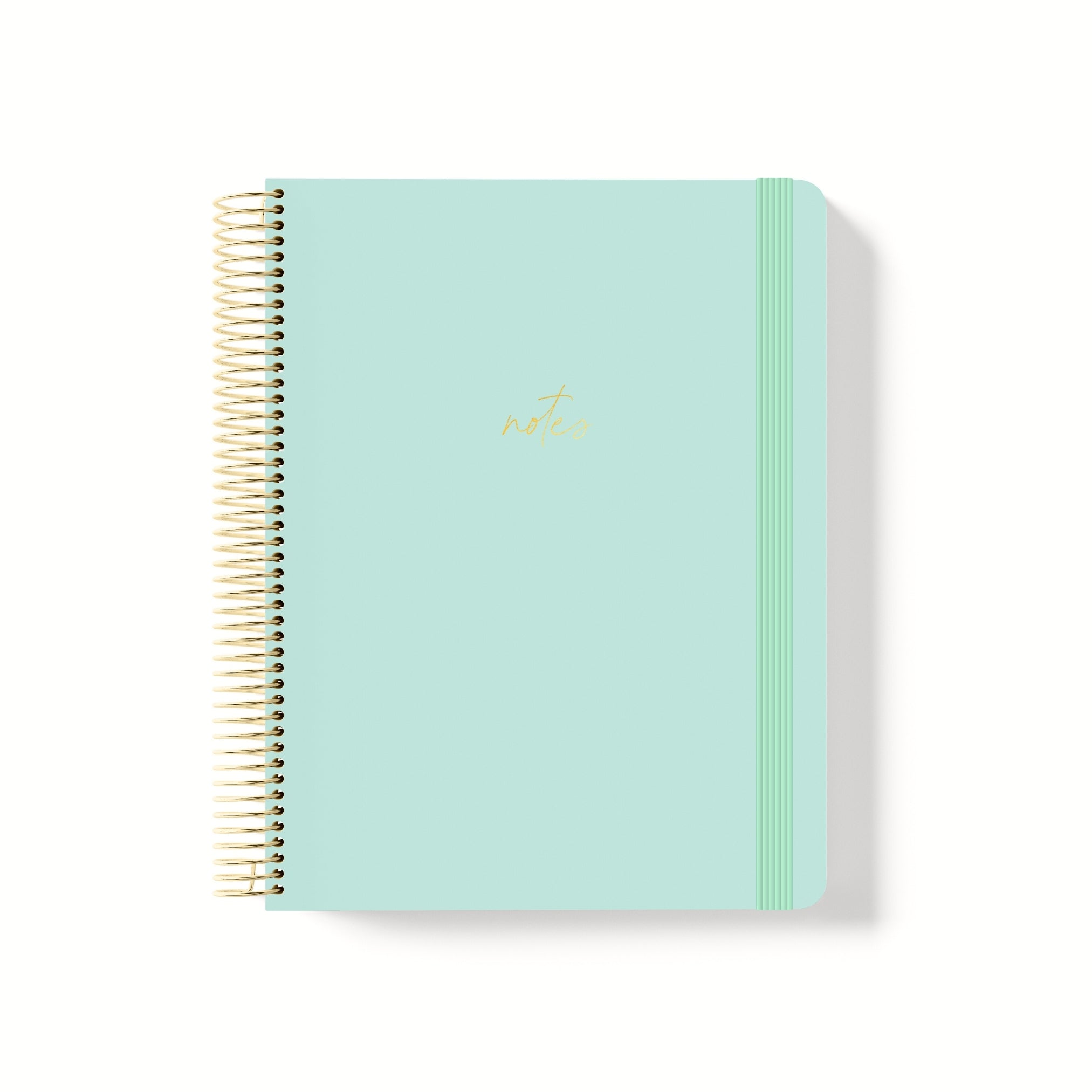 Mint green coiled notebook with gold spiral binding, matching elastic band, and metallic gold “notes” text centred on the cover.