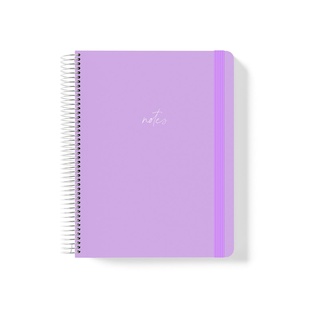 Lilac coiled notebook with matching elastic band and minimalist white script text reading “notes” centred on the cover.