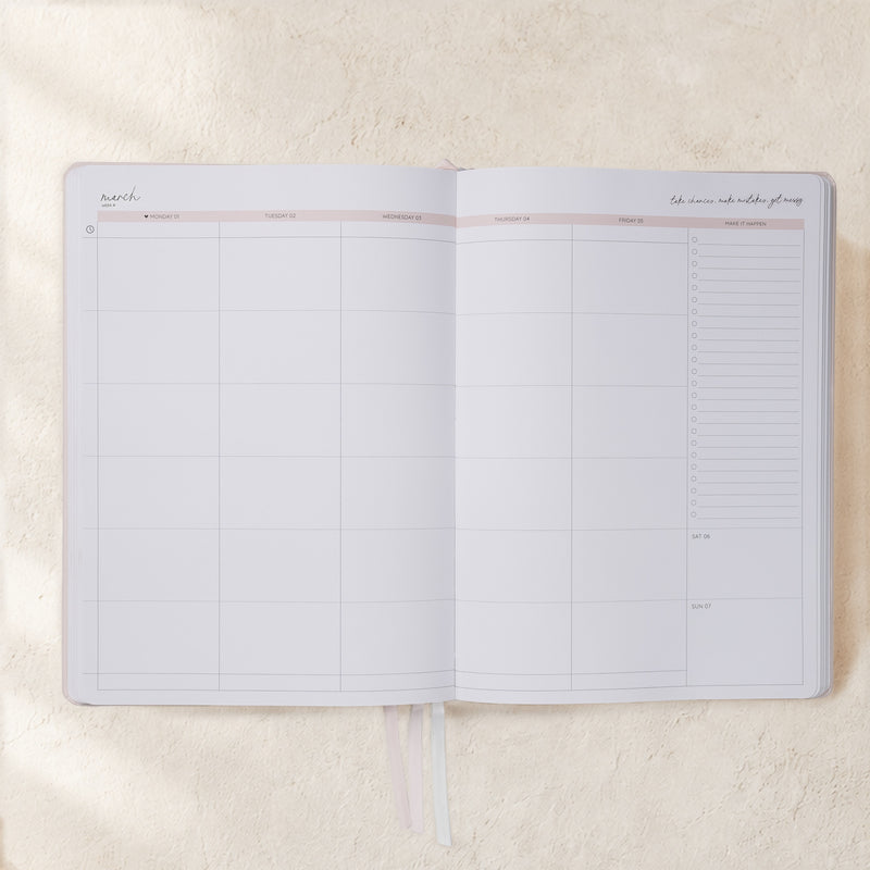Open 2027 Classic Weekly Teacher Planner Neutrals showing the soft blush week-to-an-opening spread with Monday to Friday lesson columns, Make It Happen checklist and weekend section