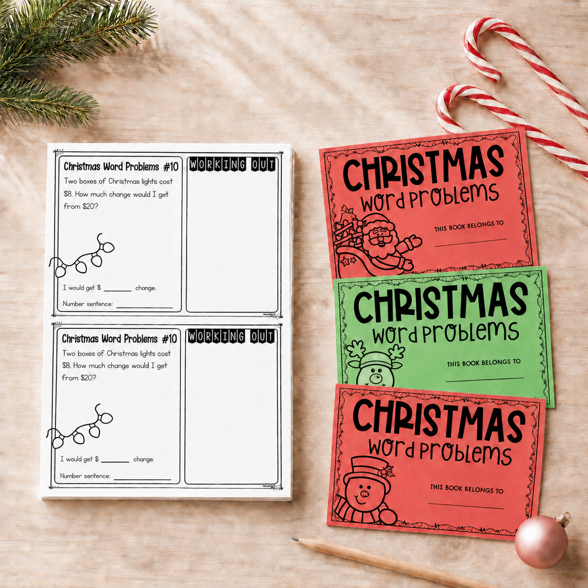 Year 2 Christmas word problem task cards fanned out beside the red and green covers.