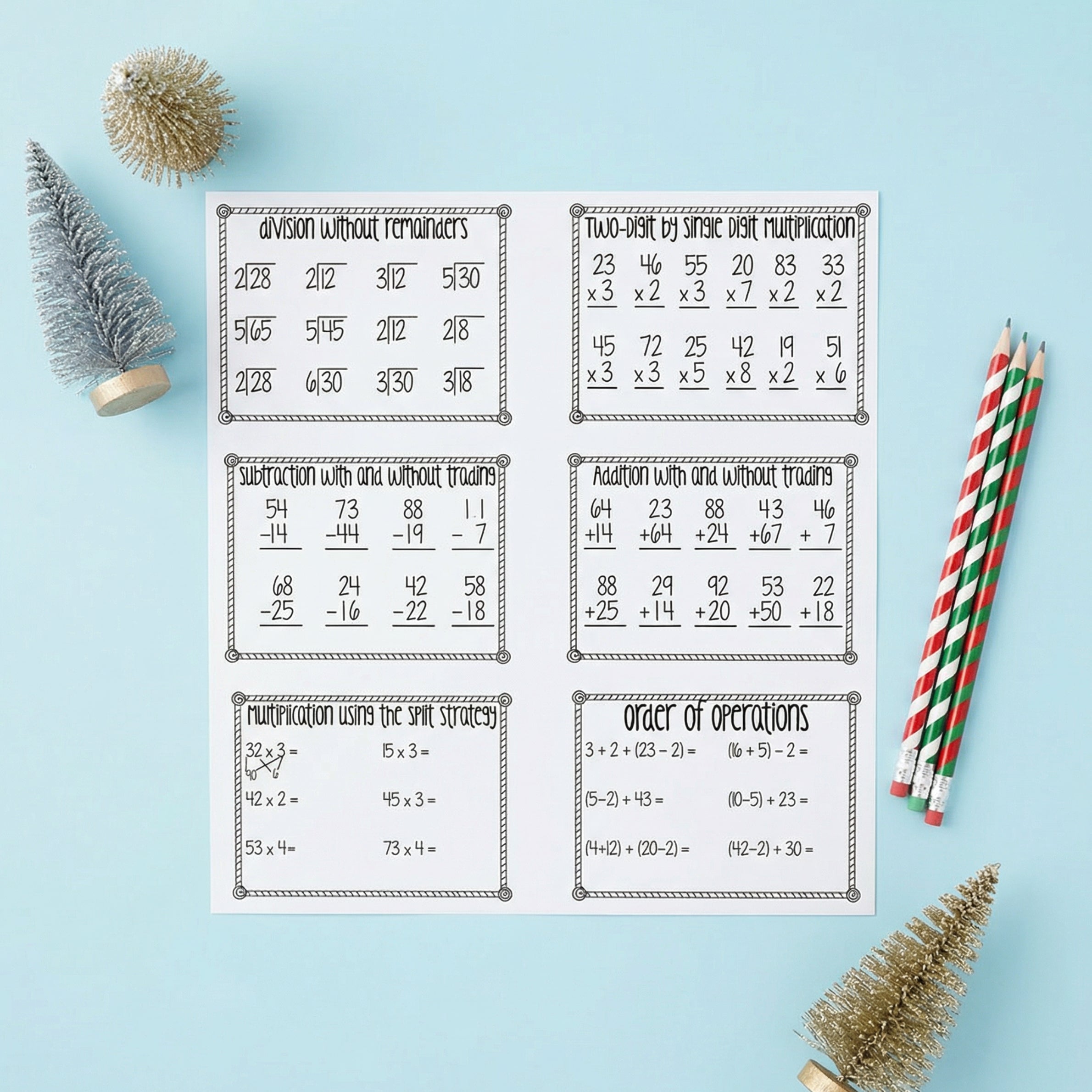 Printable math worksheet page with six boxed activities, including division without remainders, two-digit by single-digit multiplication, subtraction with and without trading, addition with and without trading, multiplication using the split strategy, and order of operations. The page is photographed on a light blue background with festive pencils and miniature Christmas trees.