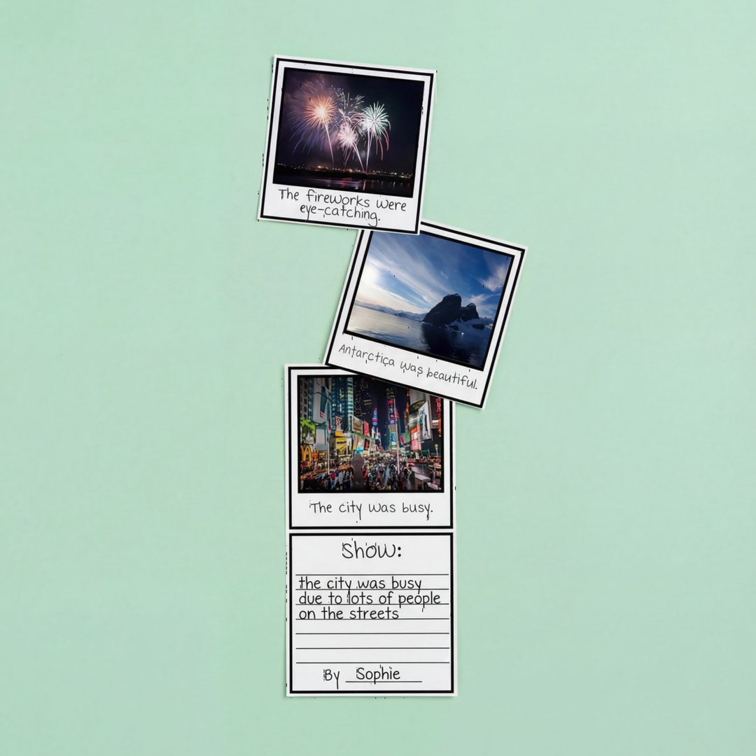 A writing activity featuring a polaroid-style “Show, Don’t Tell” strip with photo prompts like fireworks, Antarctica, and a busy city scene. Surrounded by colourful paper, crayons, and scissors, it's designed as a hands-on classroom resource.