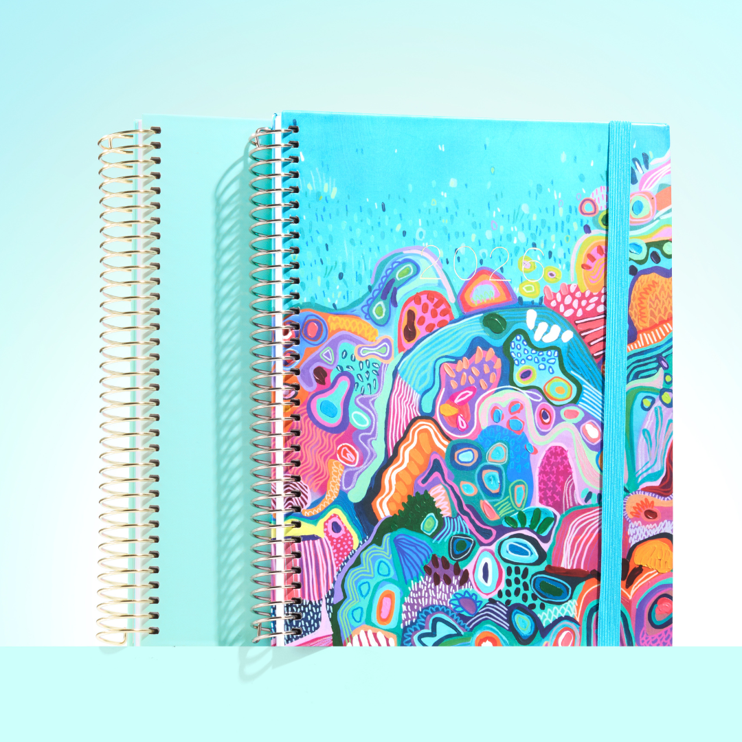 2026 teacher planner with vibrant coral reef-inspired artwork in bold colours, turquoise elastic band, and gold coil binding