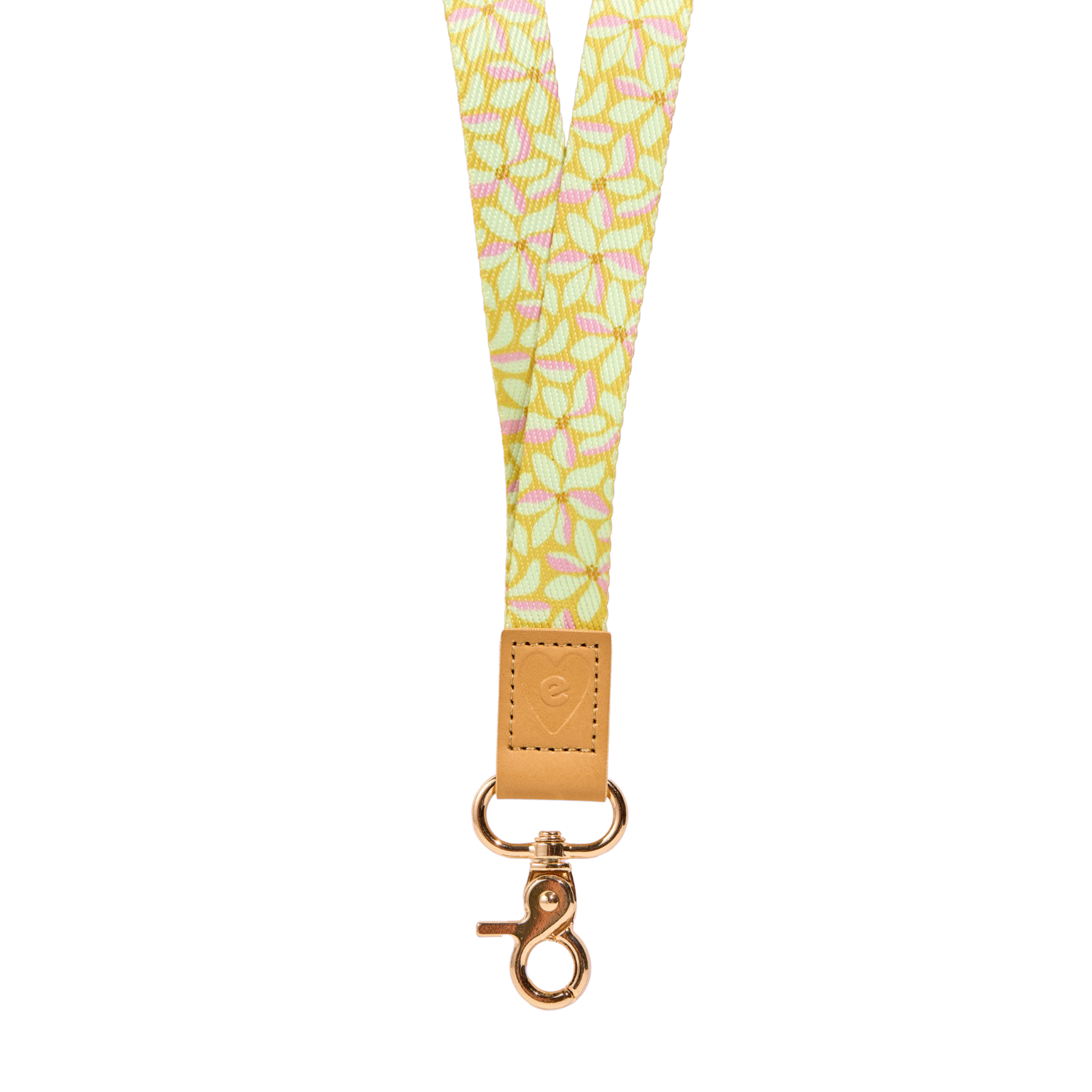 Yellow floral fabric lanyard with pastel pink  floral pattern, tan leather tab with embossed heart logo, and gold clasp, isolated on a clean white background