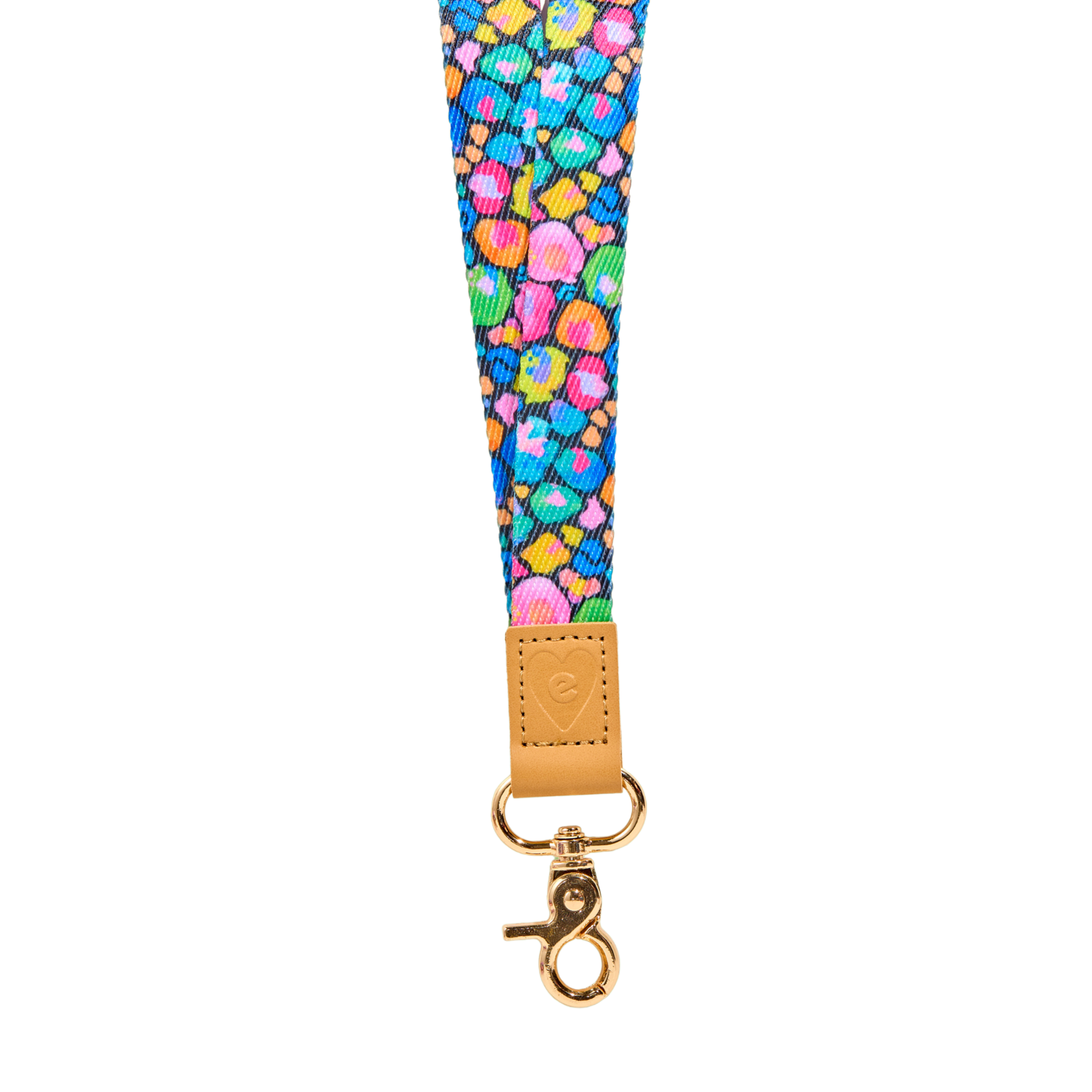 Multicolour abstract fabric lanyard with vibrant pink, green, blue and orange pattern, tan leather tab with embossed heart logo, and gold clasp, isolated on a clean white background