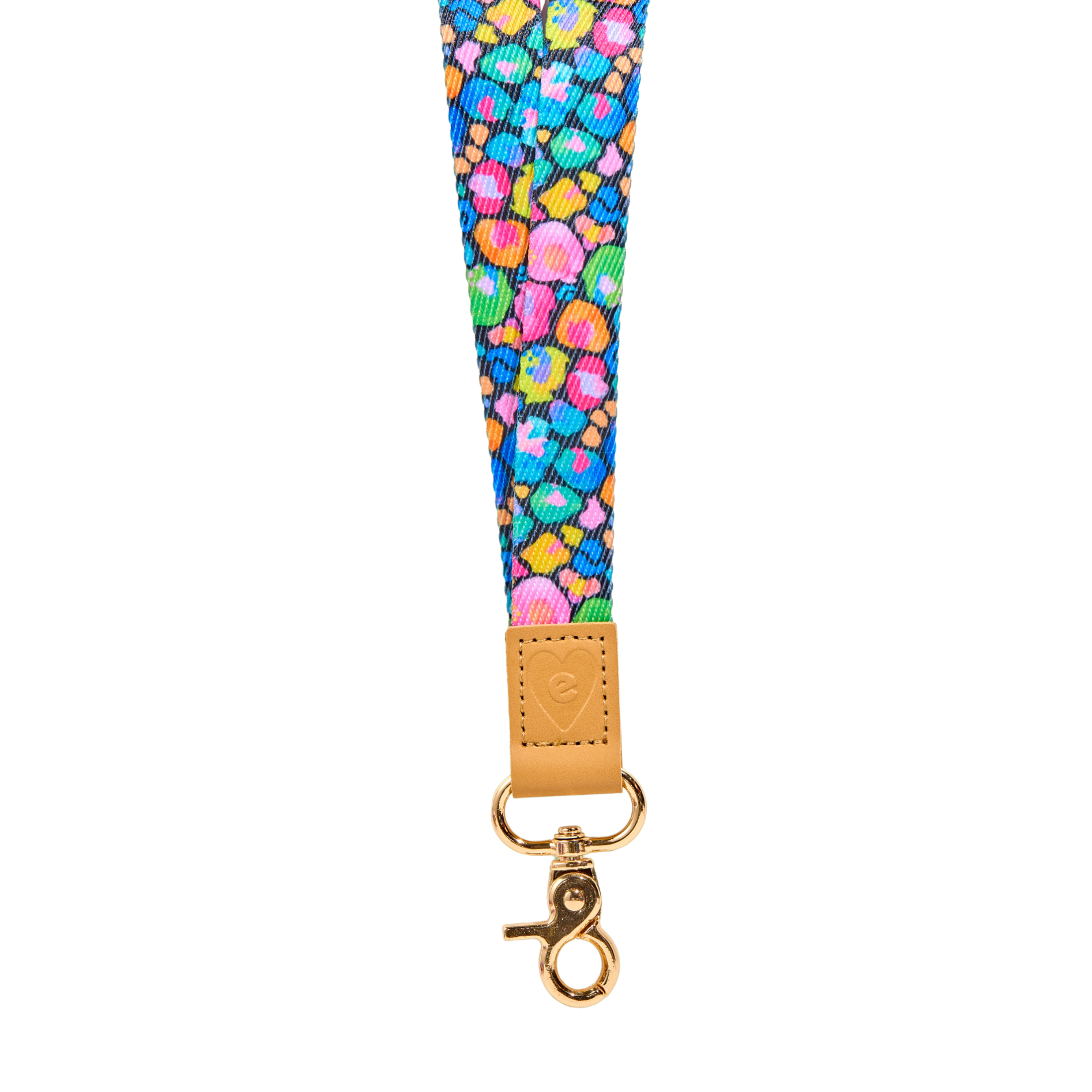 Multicolour abstract fabric lanyard with vibrant pink, green, blue and orange pattern, tan leather tab with embossed heart logo, and gold clasp, isolated on a clean white background