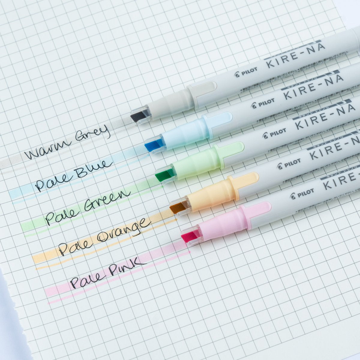 Teacher using PILOT Kire-Na Pale highlighter on planner page, soft pastel dual tip highlighter for highlighting and note-taking