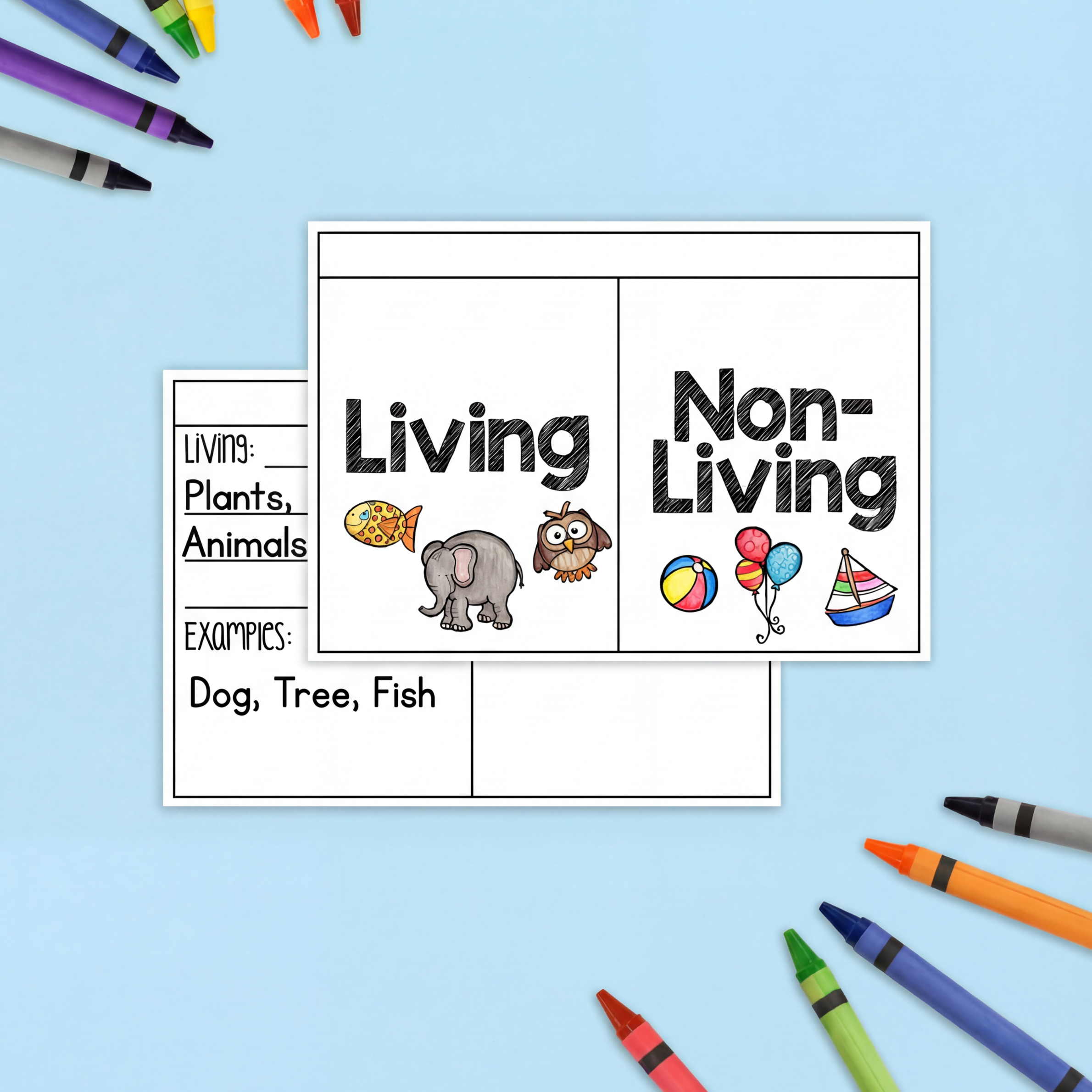 A classroom activity setup with a "Living and Non-Living" sorting worksheet, colourful cardstock, crayons, and scissors. A second worksheet with sections for listing living things and examples is partially visible underneath.