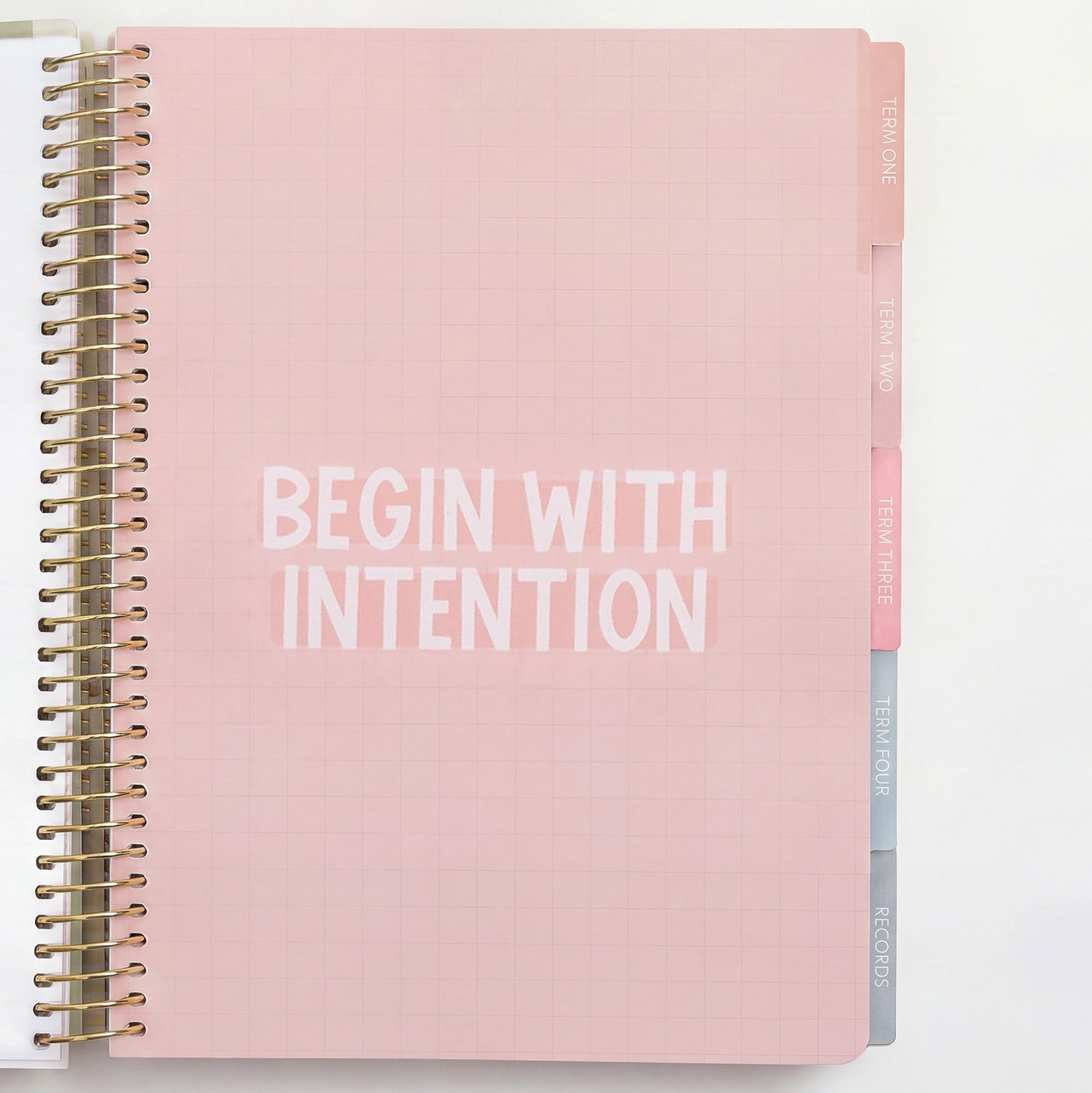 Inner page of 2027 Signature Neutral Planner with 'Begin With Intention' and pastel tabs for Term One, Two, Three, Four and Records.