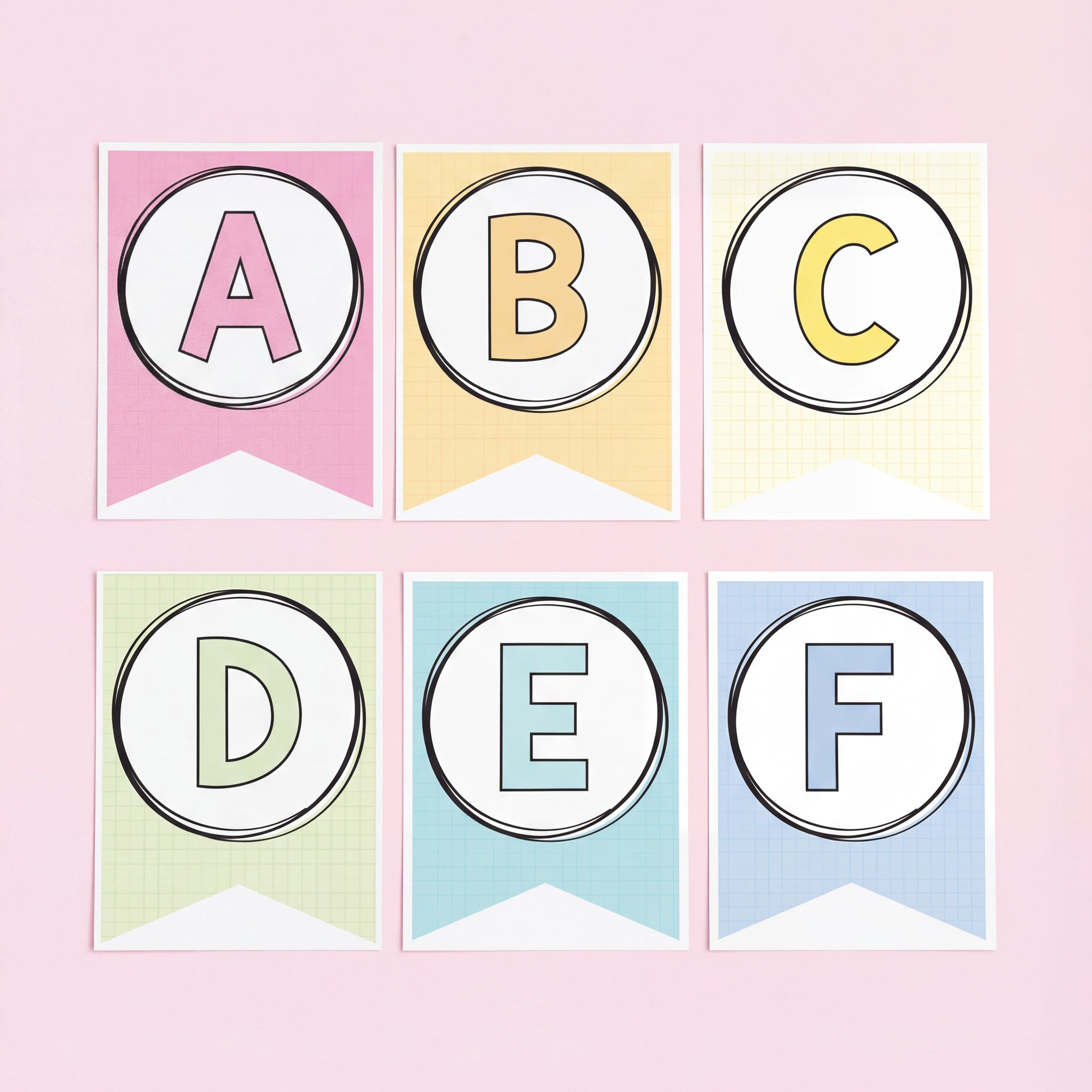 Pastel classroom alphabet bunting flags featuring the letters A to F in bold uppercase font on pink, yellow, green, and blue patterned backgrounds.