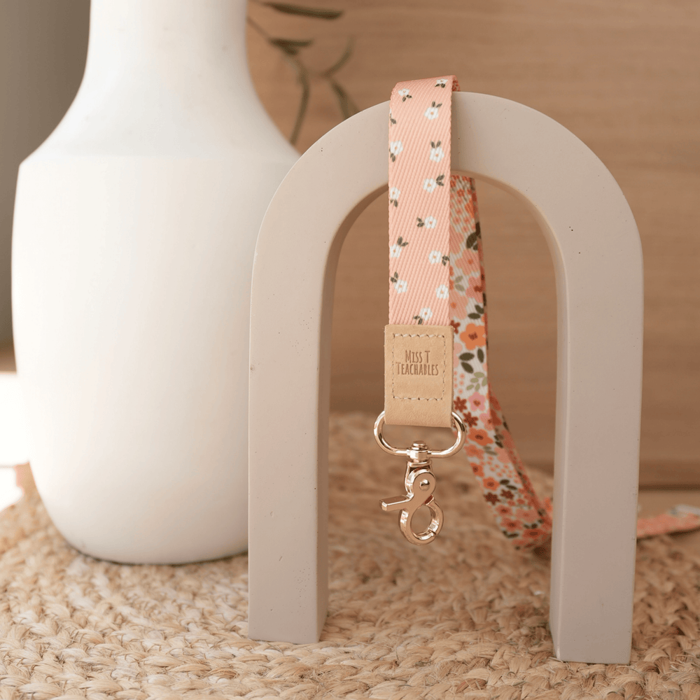 Boho Ditsy Floral teacher lanyard reversed to show the peach ditsy daisy print with tan leather tab