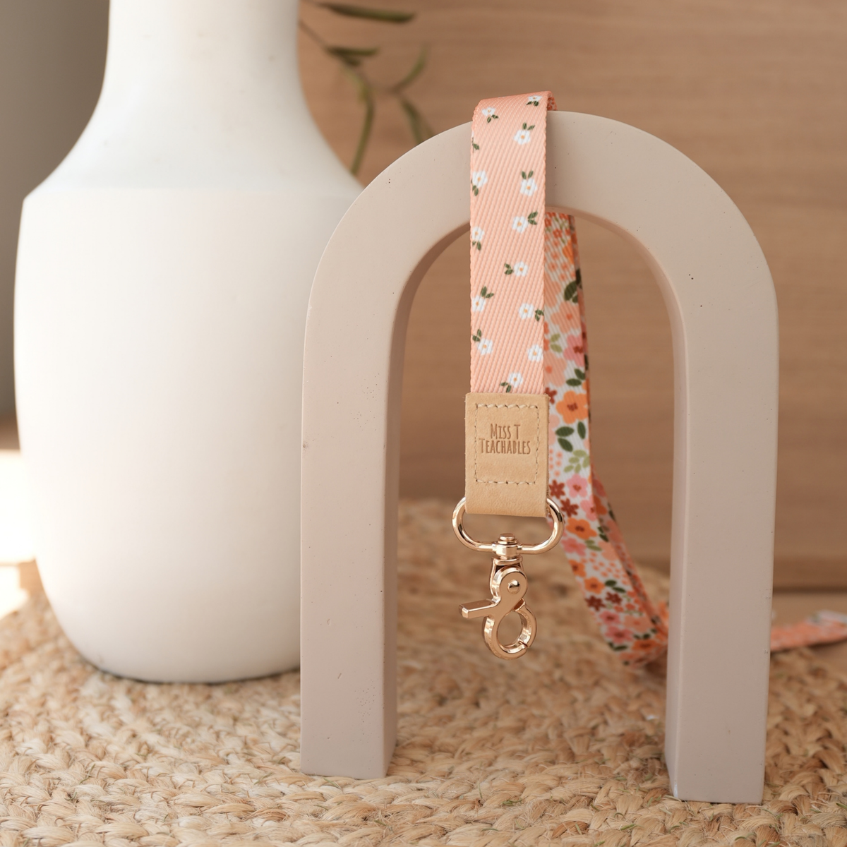 Boho Ditsy Floral teacher lanyard reversed to show the peach ditsy daisy print with tan leather tab