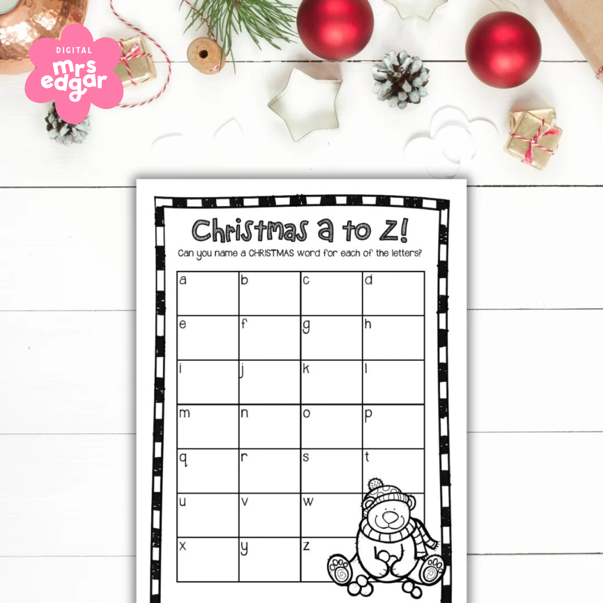 Digital A to Z Christmas card on a desk, displayed with other Christmas decorations designed to enhance vocabulary and celebrate the festive spirit.
