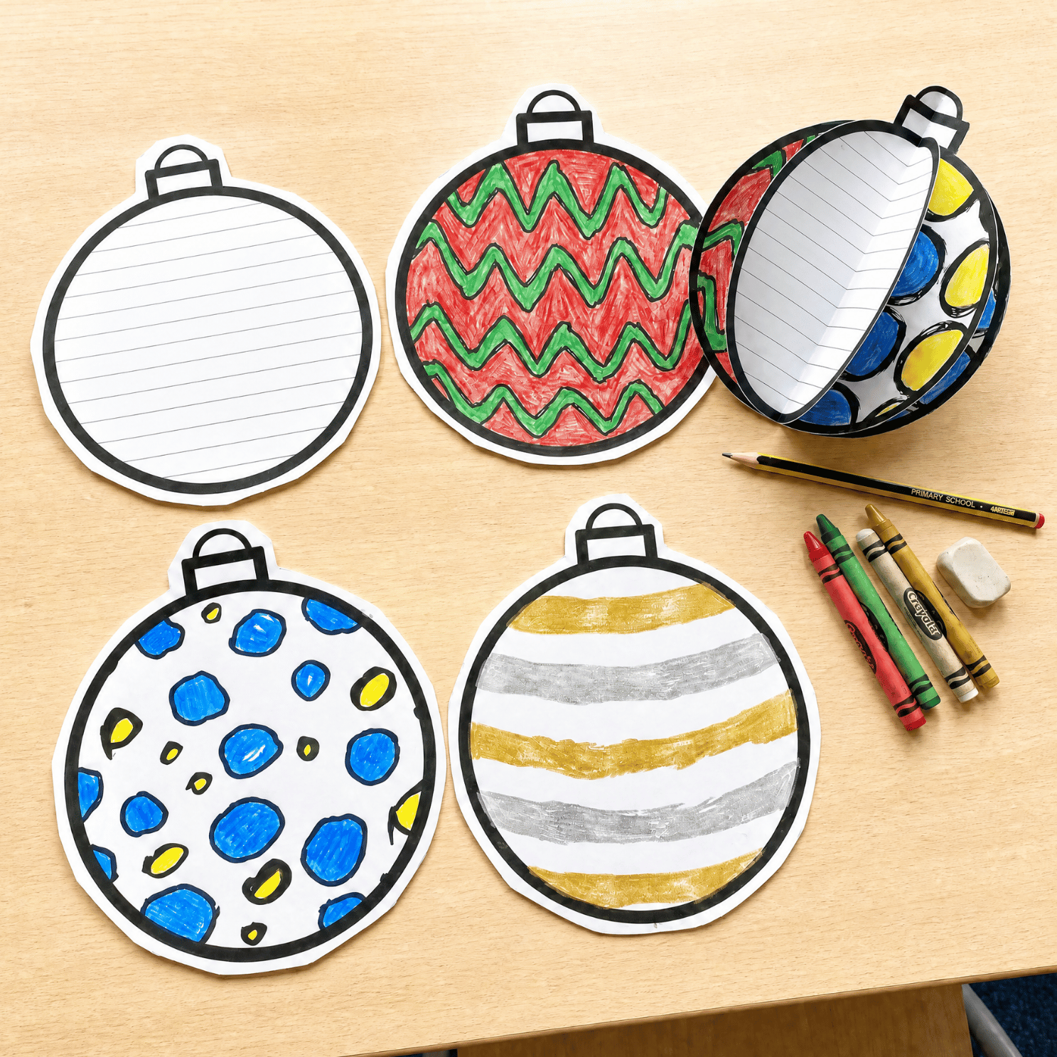 Five blank Christmas baubles with different patterns ready to colour and decorate. Craft supplies including pencils visible.