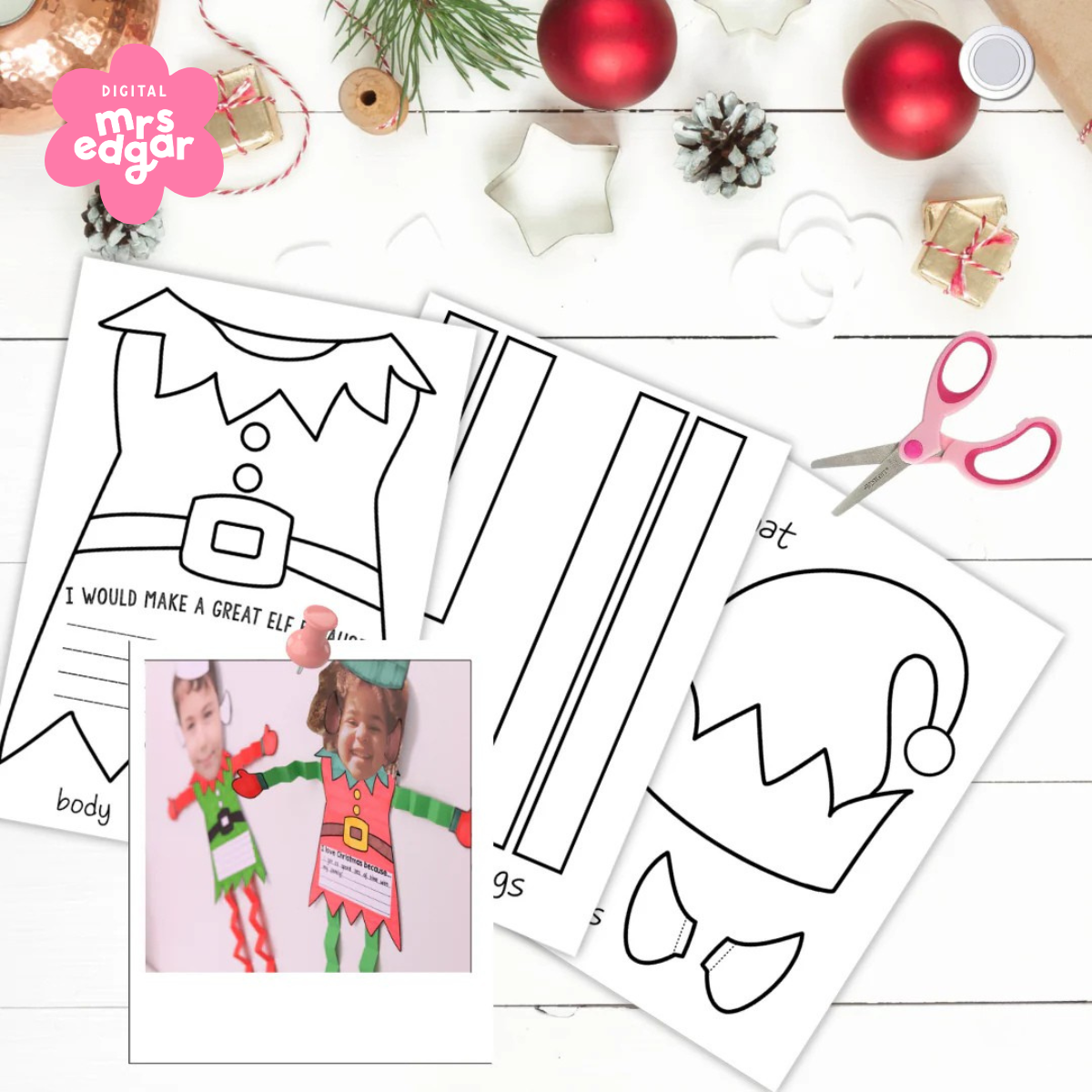 Completed elf crafts displayed on a white surface, with colourful elf cutouts featuring children's photos attached to the head and personalised writing on the body.