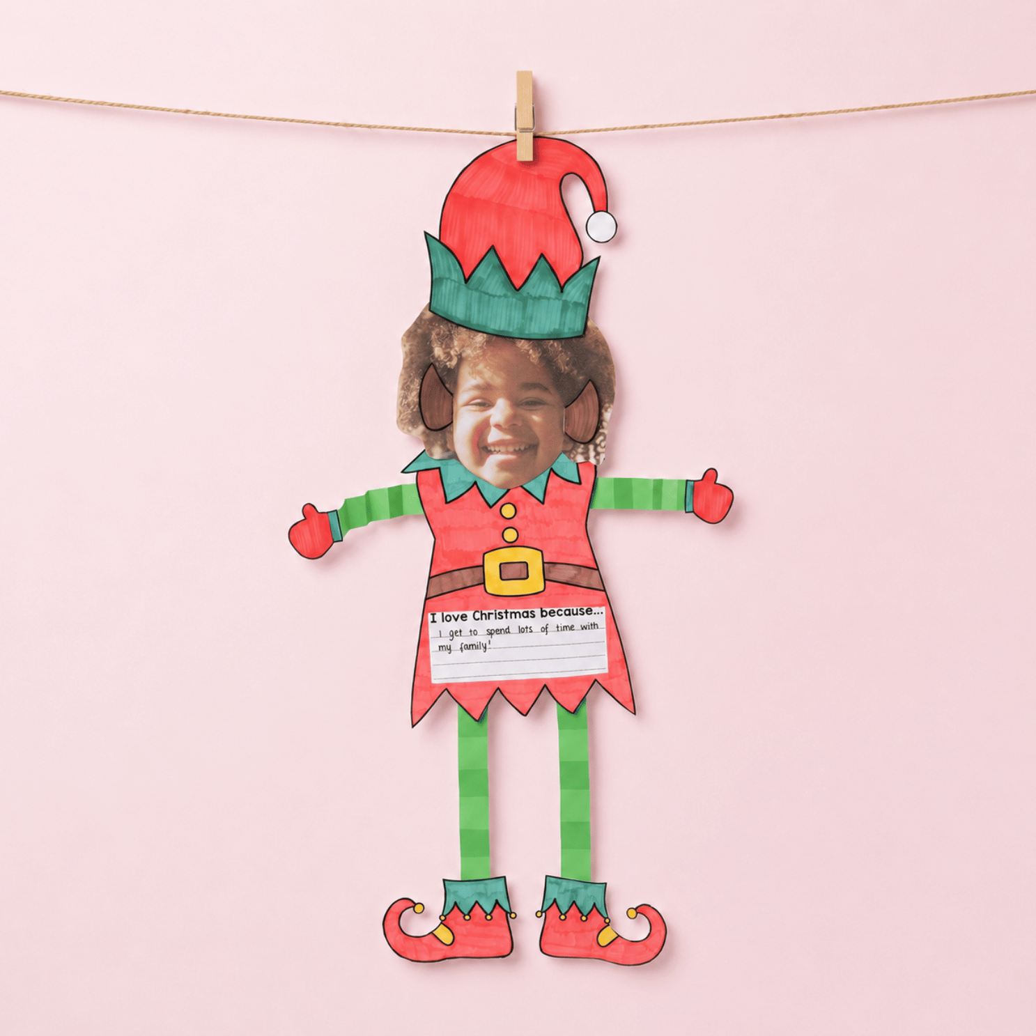 Christmas Elf craft template with photo space at top, "I love Christmas because..." prompt, and decorative elf illustration with text box at bottom.