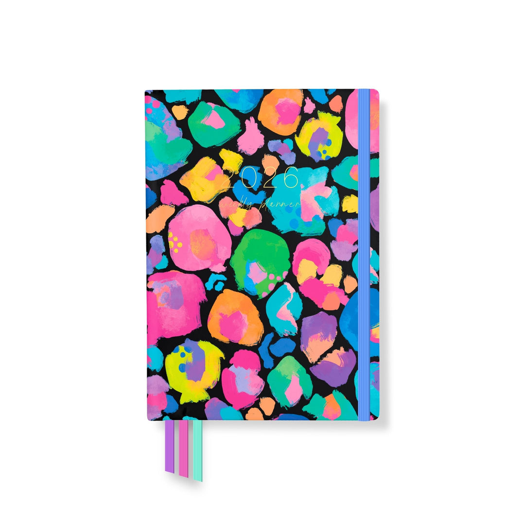 2026 Classic Everyday Planner front cover with a bold rainbow leopard print in vibrant pink, yellow, green, and blue tones on a black background.