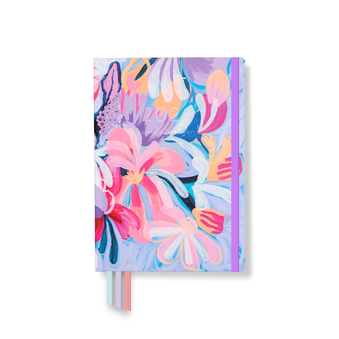 Front cover of the 2026 Classic Everyday Planner featuring bold pink, purple, and yellow floral artwork with purple elastic and ribbon bookmarks.