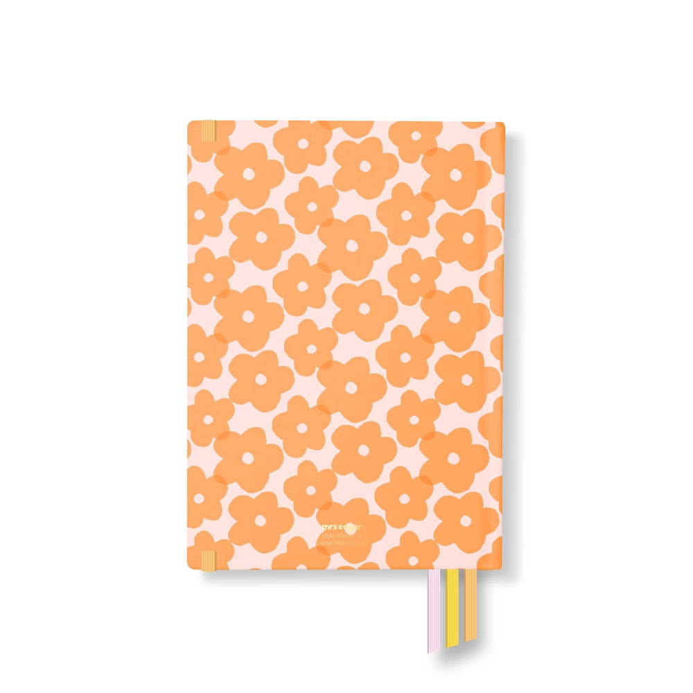 Back cover of 2026 planner featuring an all-over orange flower pattern on a soft pink base, with yellow, pink, and orange ribbon bookmarks.