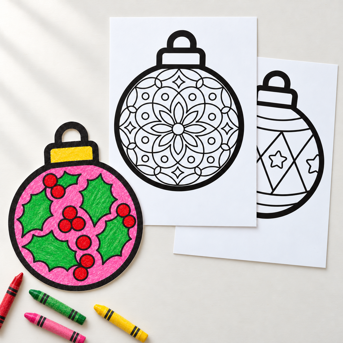 Christmas bauble craft worksheets coloured with wax crayons, flat lay of printable bauble designs