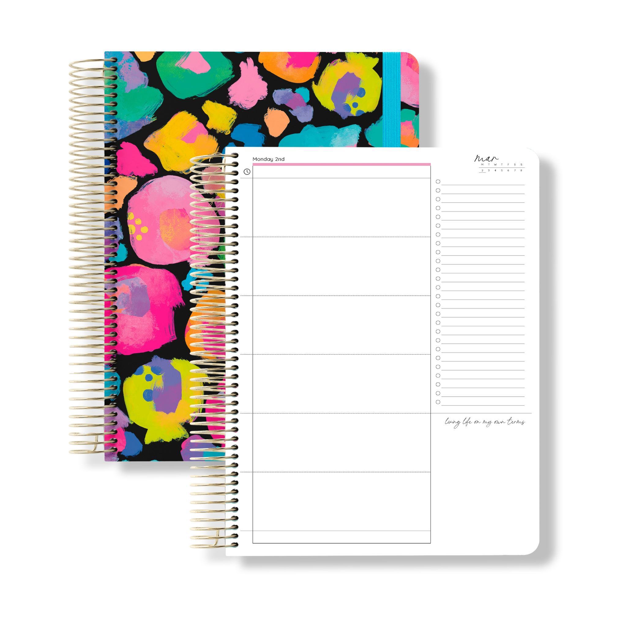 2026 signature planner with a bold rainbow leopard print cover and blue elastic, shown next to an open daily planning page.