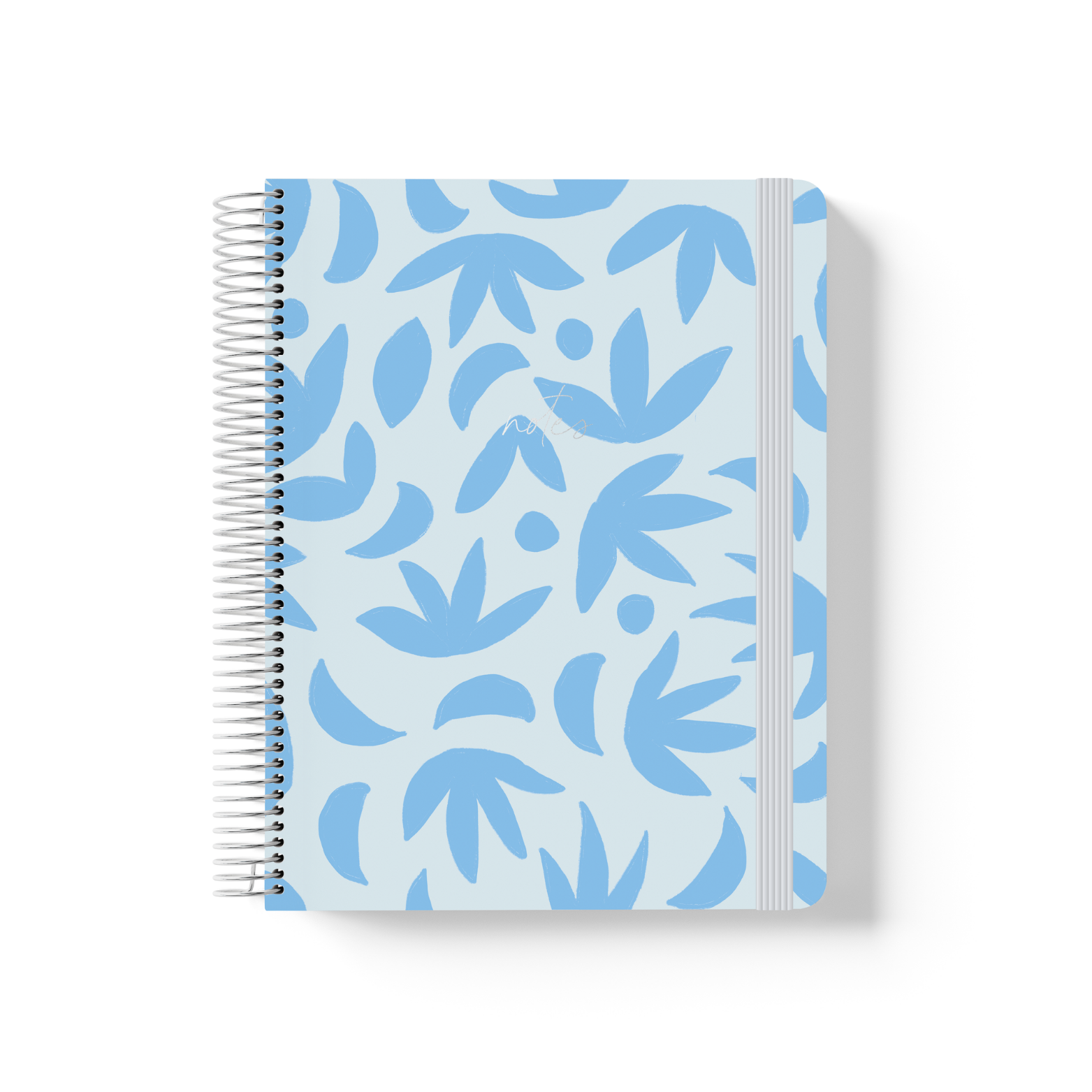 Sunburst Sky spiral notebook with a blue botanical leaf pattern on a pale blue background, silver coil binding, and grey elastic closure.