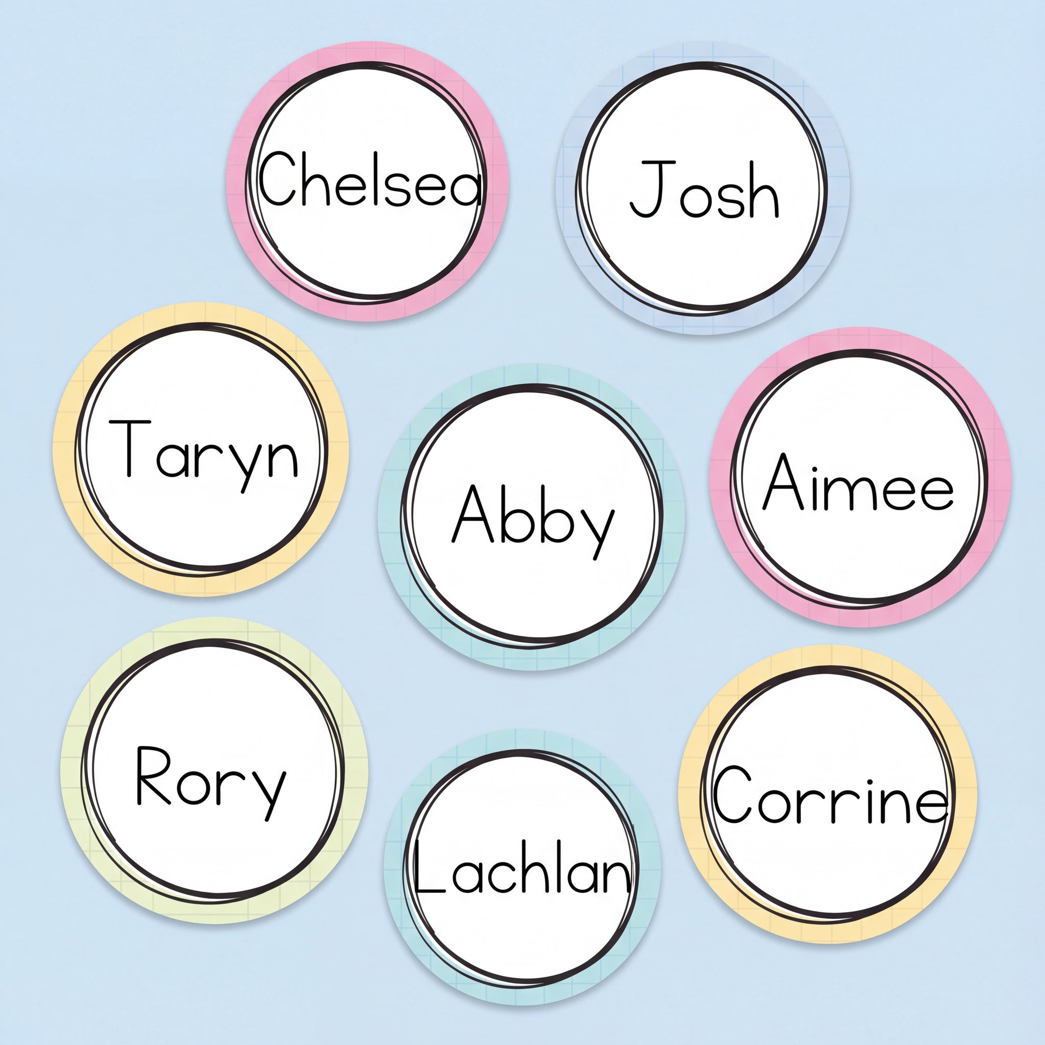 Pastel circular classroom name tags featuring student names in a clean font, designed for desk labels, lockers, or classroom organisation.