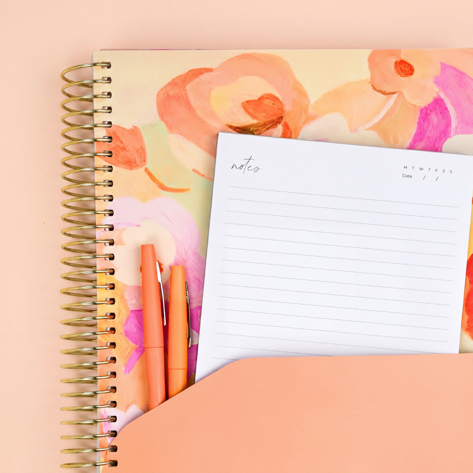 2027 Love Fool Signature Planner showing peach pocket sleeve with notes page and orange pens, gold coil on a peach background.