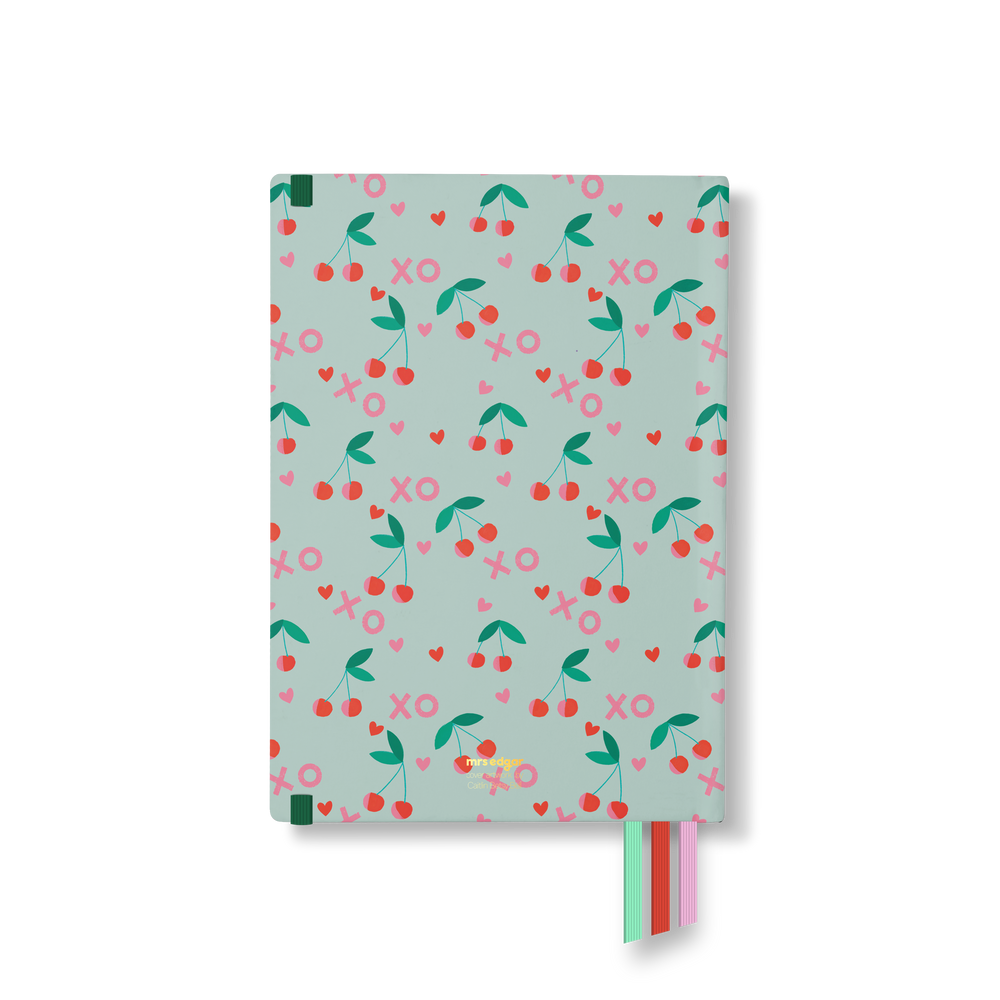 Mint green planner back cover with repeating cherry, heart, and “XO” pattern, and three ribbon bookmarks in red, mint, and pink.
