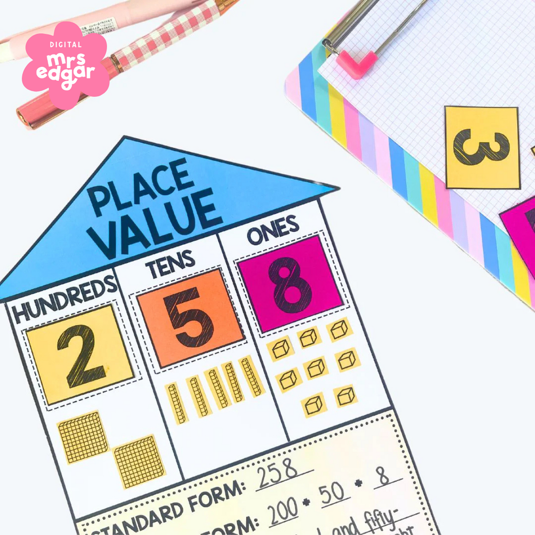 A colourful place value house activity for the number 258, placed on a desk with a rainbow clipboard, pens, and number cutouts.