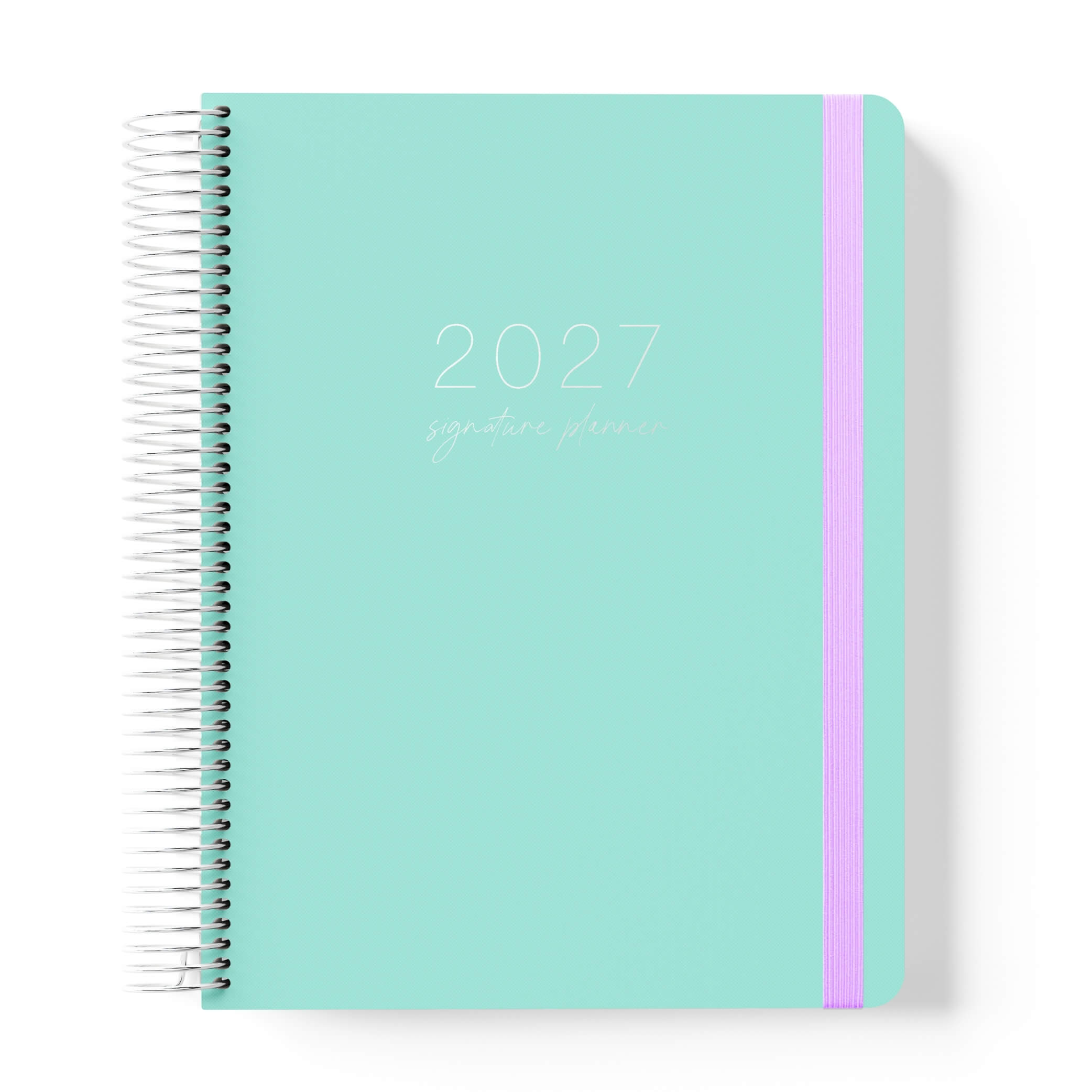 2027 Signature Planner in Seafoam with tonal text on a mint green cover, silver coil binding, and lilac elastic closure.