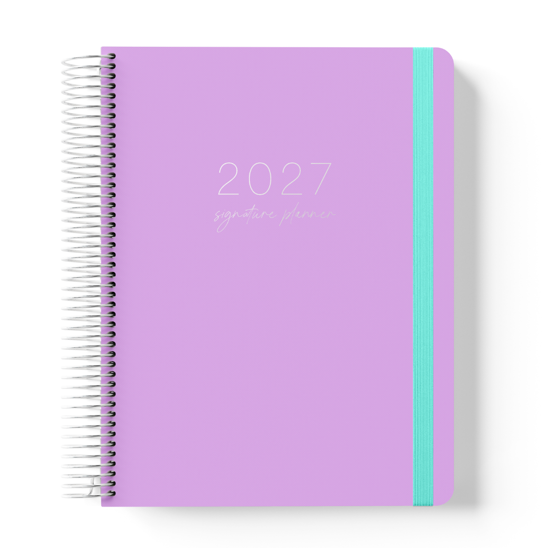 2027 Signature Daily Planner in Lilac with tonal text on a soft purple cover, silver coil binding, and teal elastic closure.
