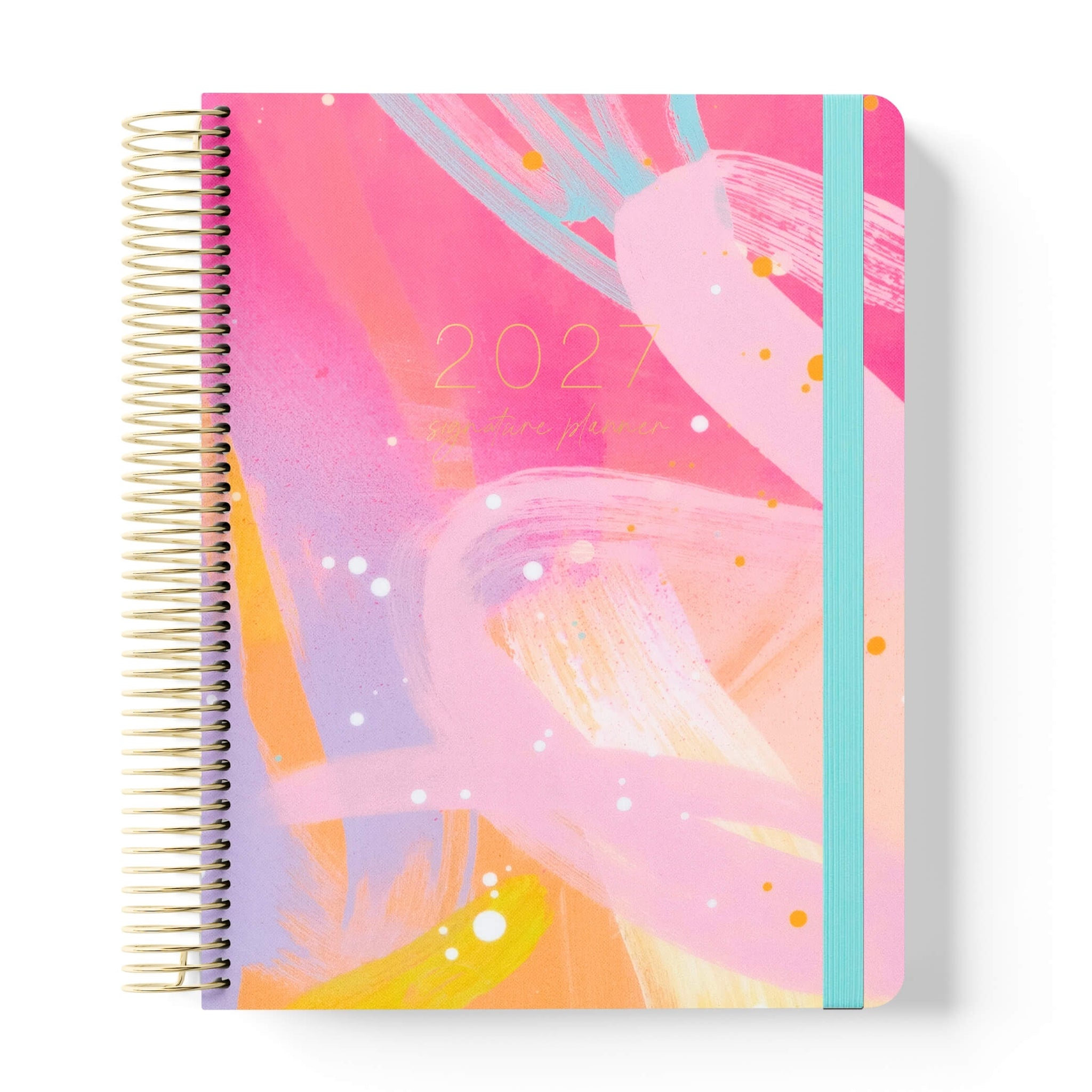 2027 Signature Planner in Solar Glow with abstract pink and teal brushstroke artwork, gold coil and teal elastic closure.