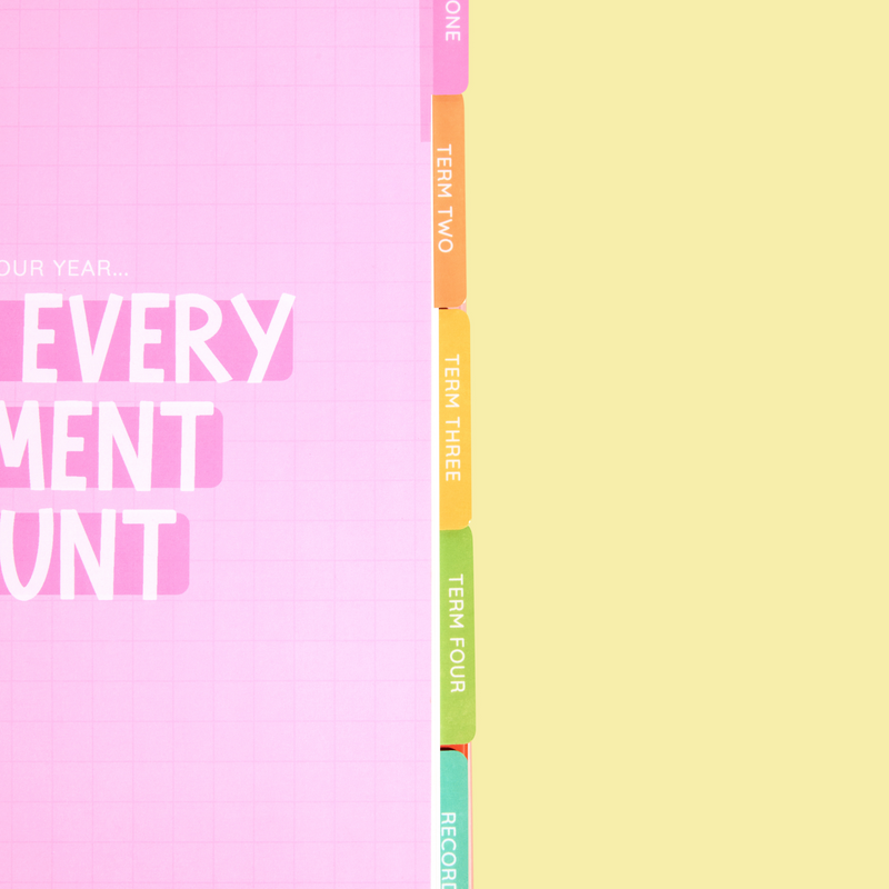 Inside page of a 2026 planner with pastel section tabs labeled Term One through Records, and bold white text reading “Make Every Moment Count” on a pink grid background.